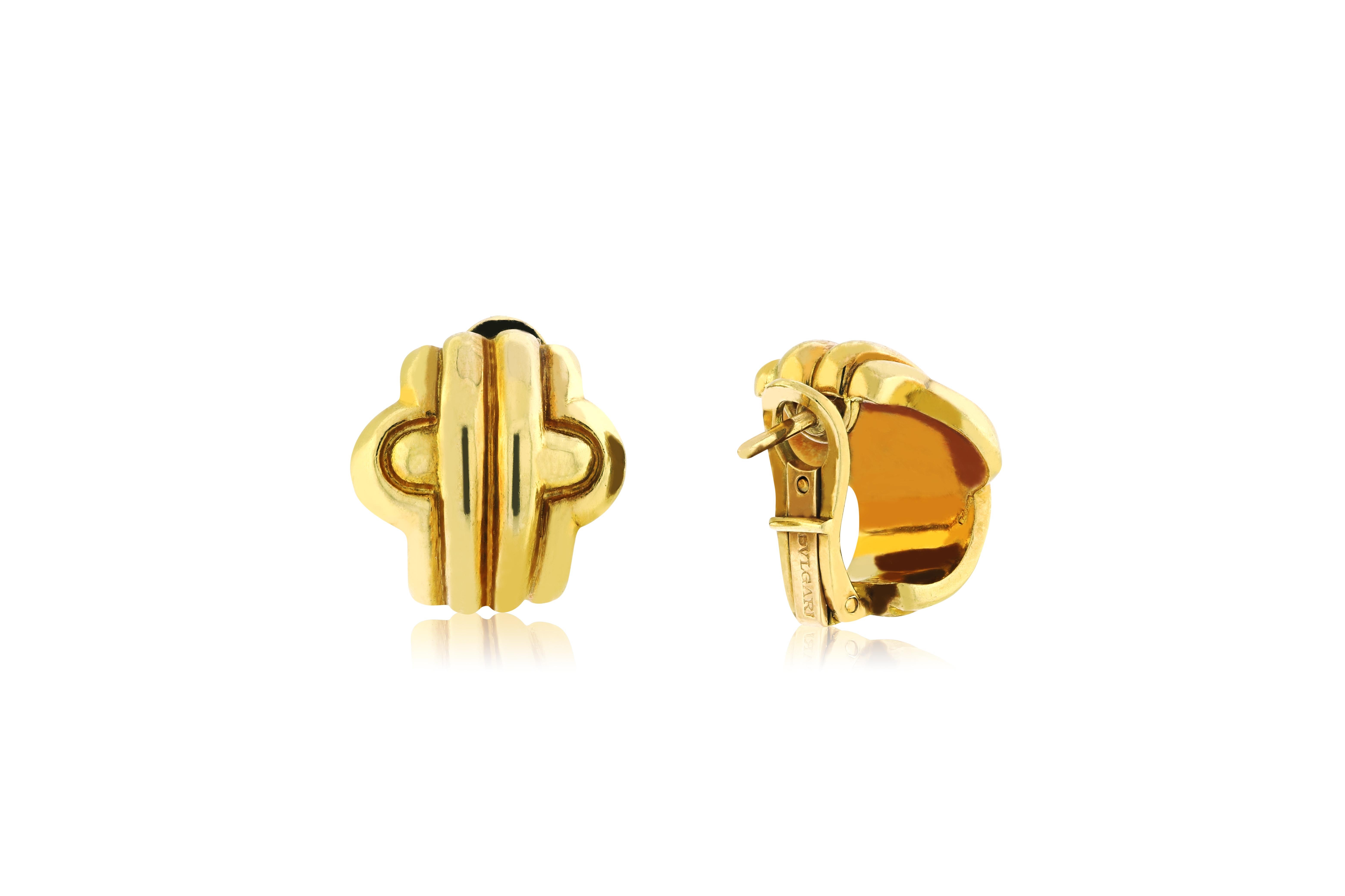 These BVLGARI Prantesi earrings feature 18 kt of yellow gold with a scrolled geometric design, signed BVLGARI approximately 11 grams total weight. Post and clip backs. 
