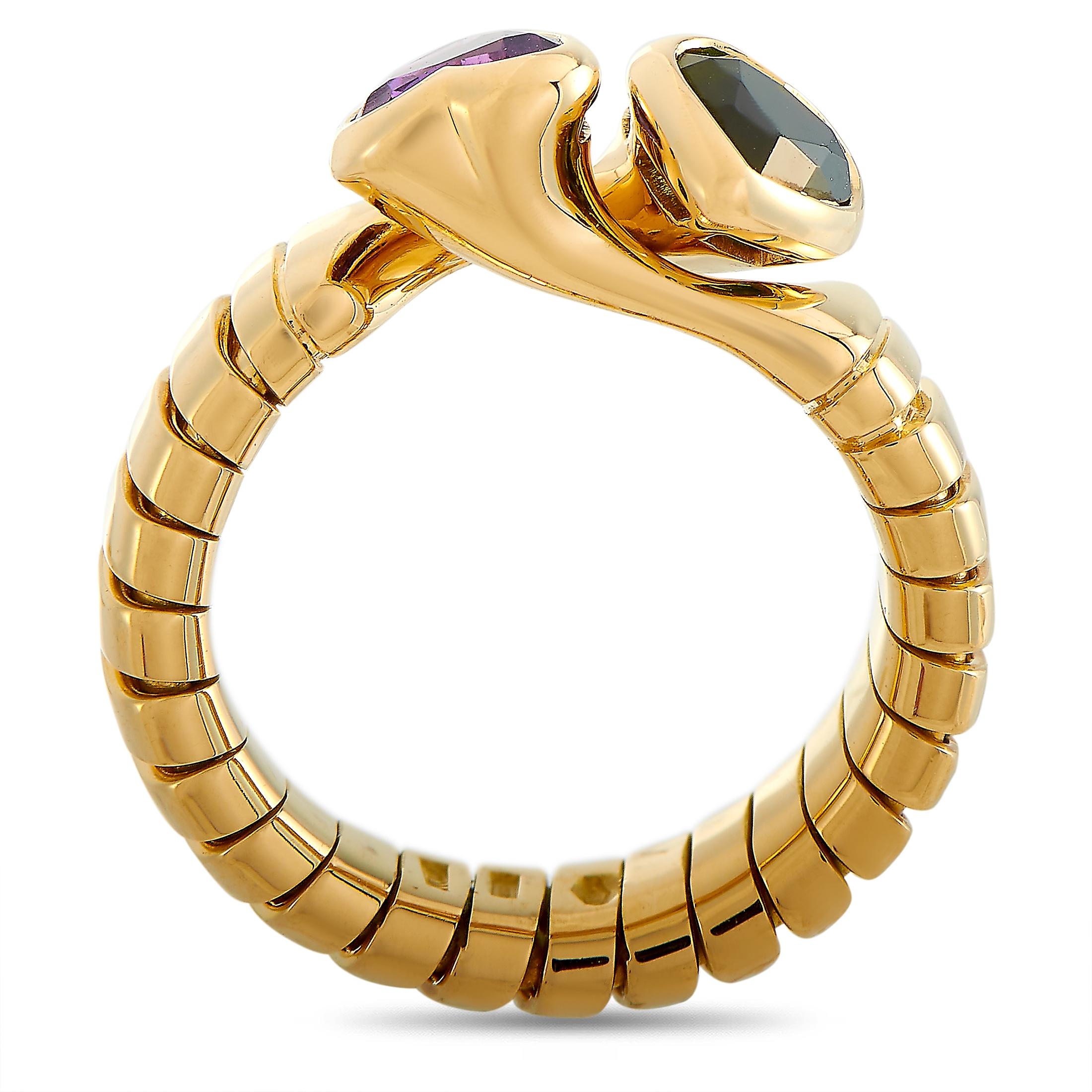 This Bvlgari ring is made of 18K yellow gold and embellished with a peridot and an amethyst. The ring weighs 8.6 grams and boasts band thickness of 5 mm and top height of 5 mm, while top dimensions measure 8 by 12 mm.
 
 Offered in estate condition,