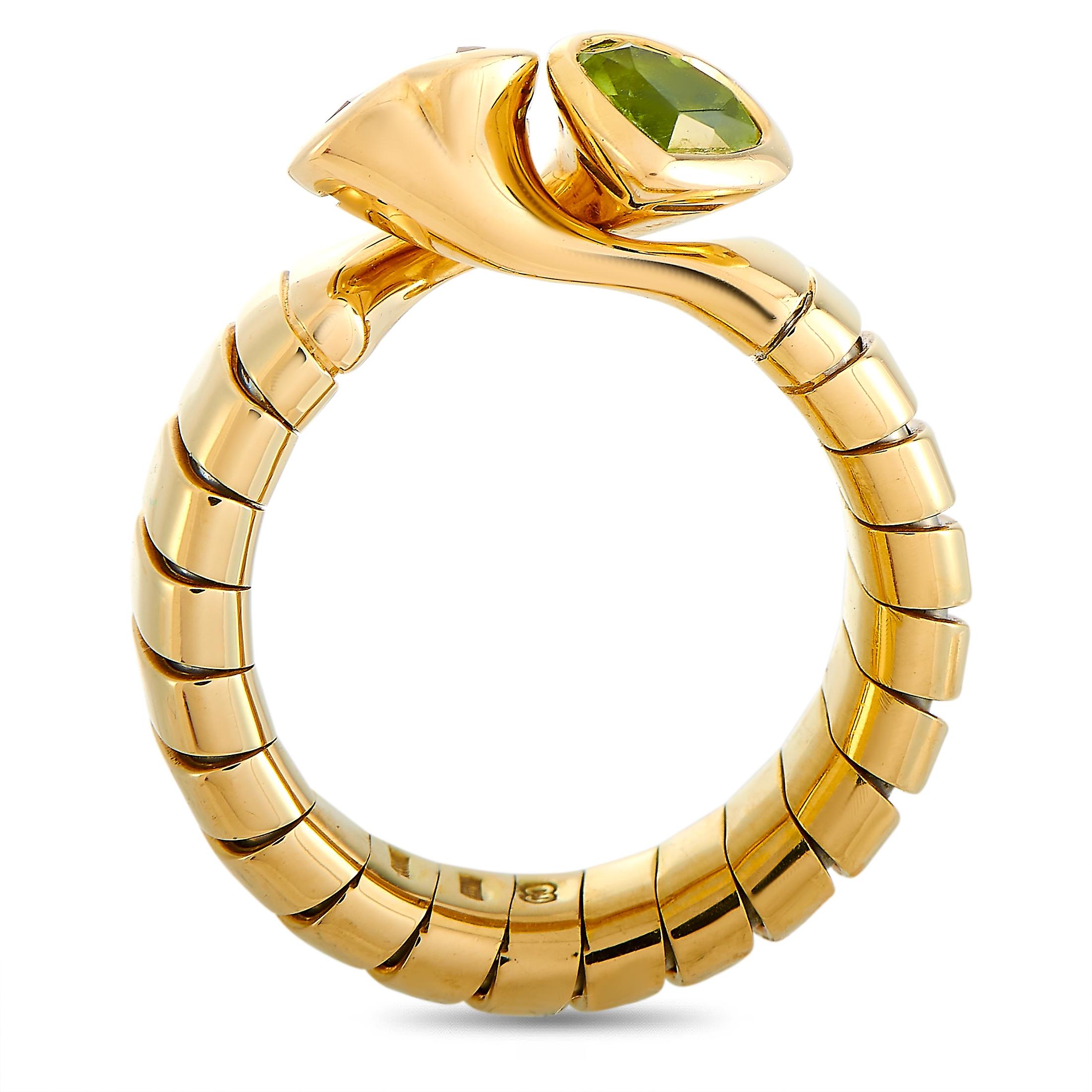 The Bvlgari ring is made of 18K yellow gold and embellished with a peridot and a citrine. The ring weighs 8.1 grams and boasts band thickness of 5 mm and top height of 5 mm, while top dimensions measure 8 by 12 mm.
 
 This jewelry piece is offered