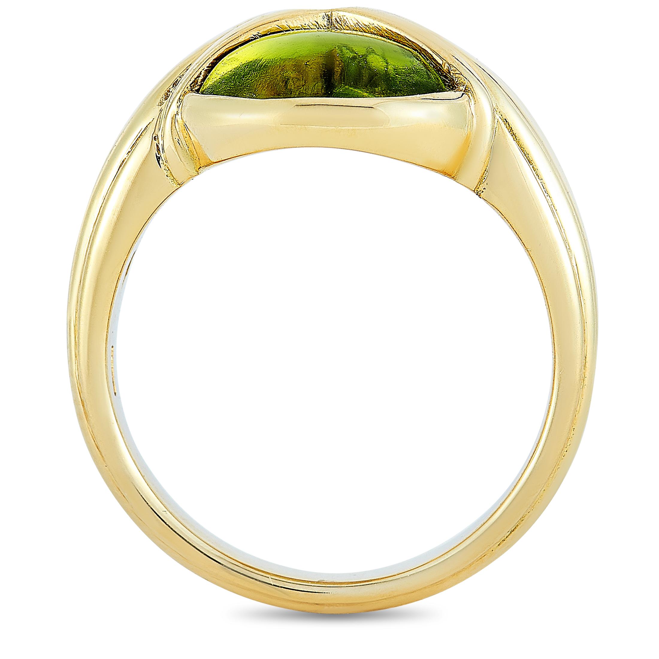 This Bvlgari ring is crafted from 18K yellow gold and embellished with a peridot and a tourmaline. The ring weighs 8.3 grams and boasts band thickness of 3 mm and top height of 6 mm, while top dimensions measure 12 by 12 mm.

Offered in estate