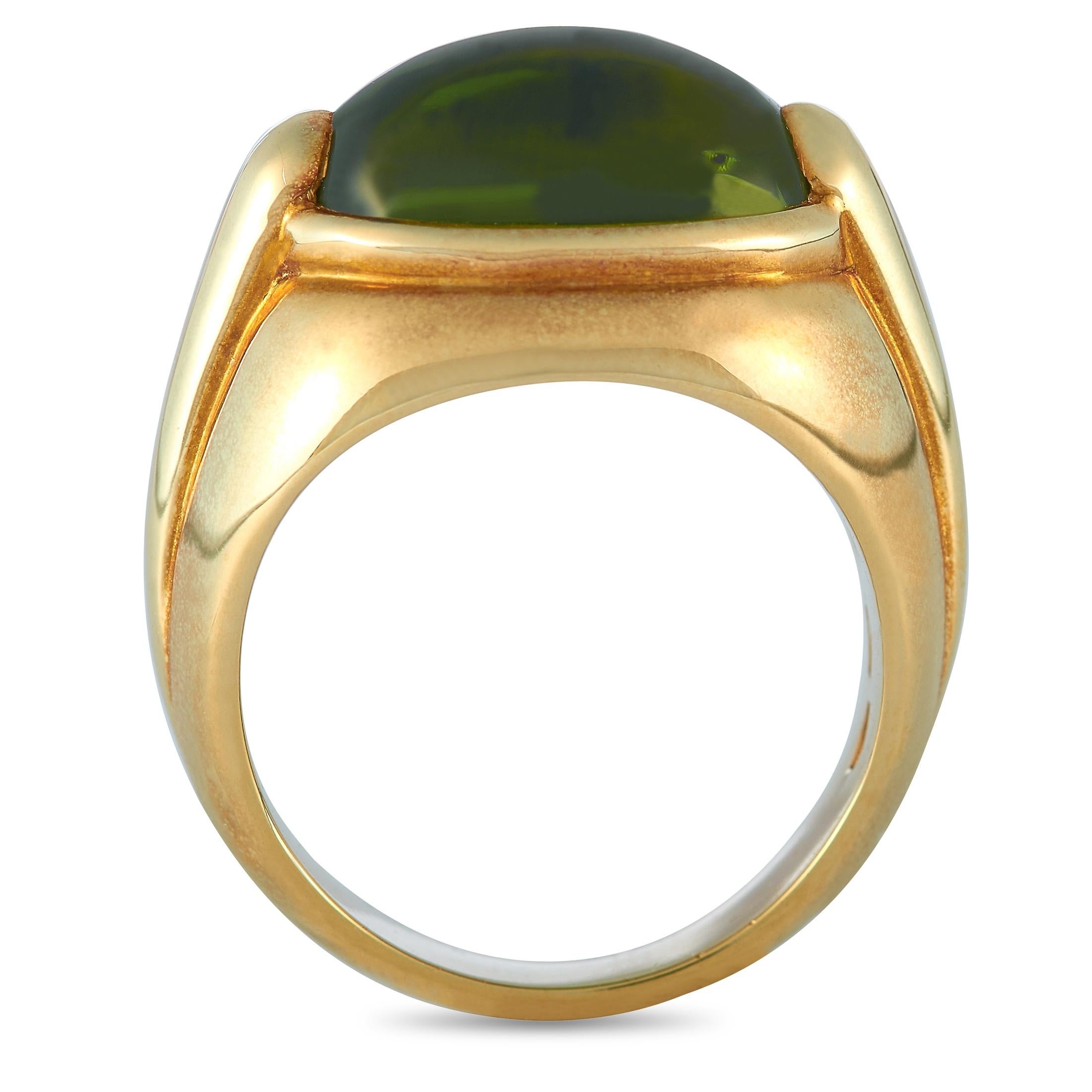 This Bvlgari ring is made of 18K yellow gold and set with a peridot. The ring weighs 14 grams and boasts band thickness of 3 mm and top height of 8 mm, while top dimensions measure 15 by 10 mm.
 
 Offered in estate condition, this jewelry piece