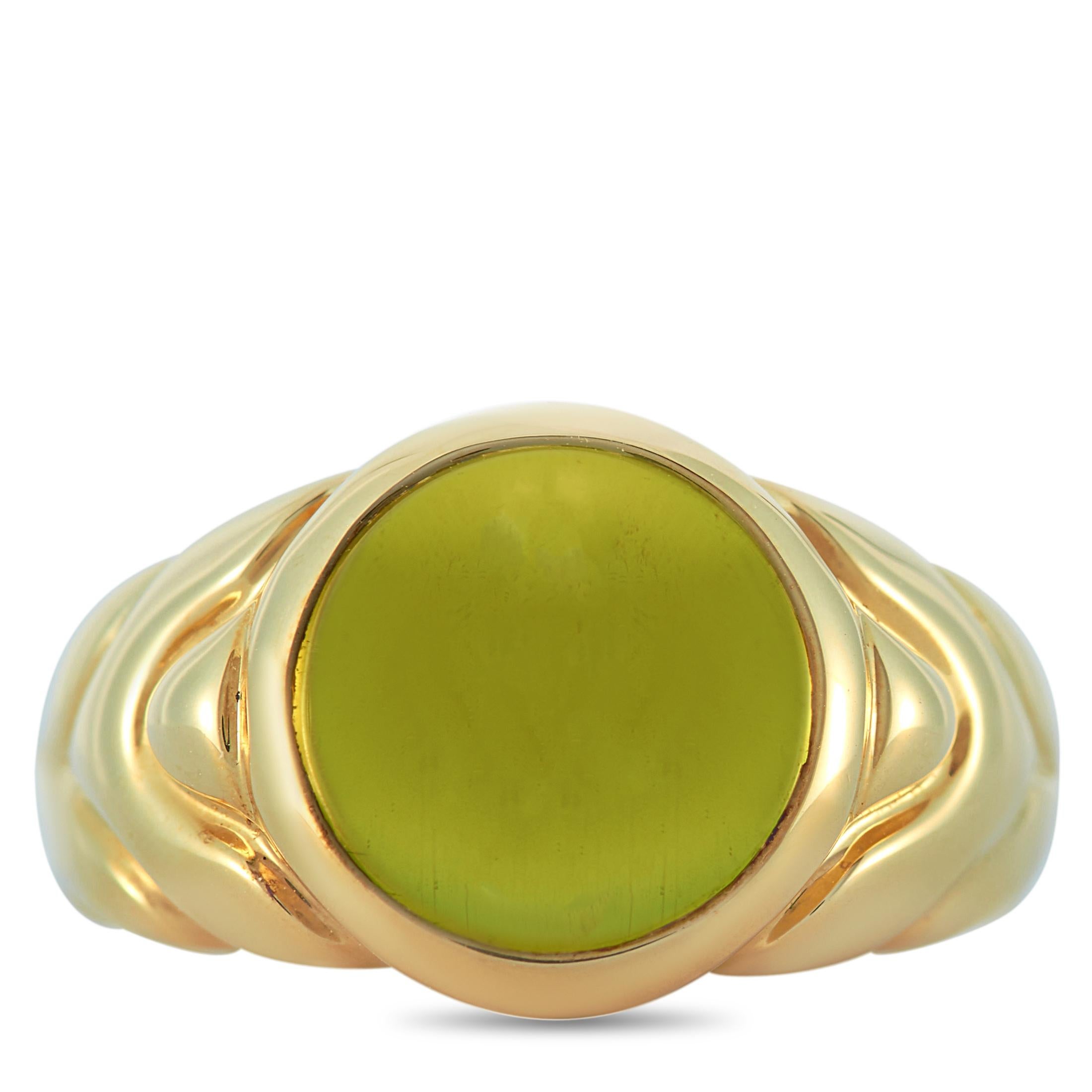 This Bvlgari ring is made of 18K yellow gold and embellished with a peridot. The ring weighs 11.1 grams and boasts band thickness of 3 mm and top height of 8 mm, while top dimensions measure 10 by 10 mm.
 
 Offered in estate condition, this item