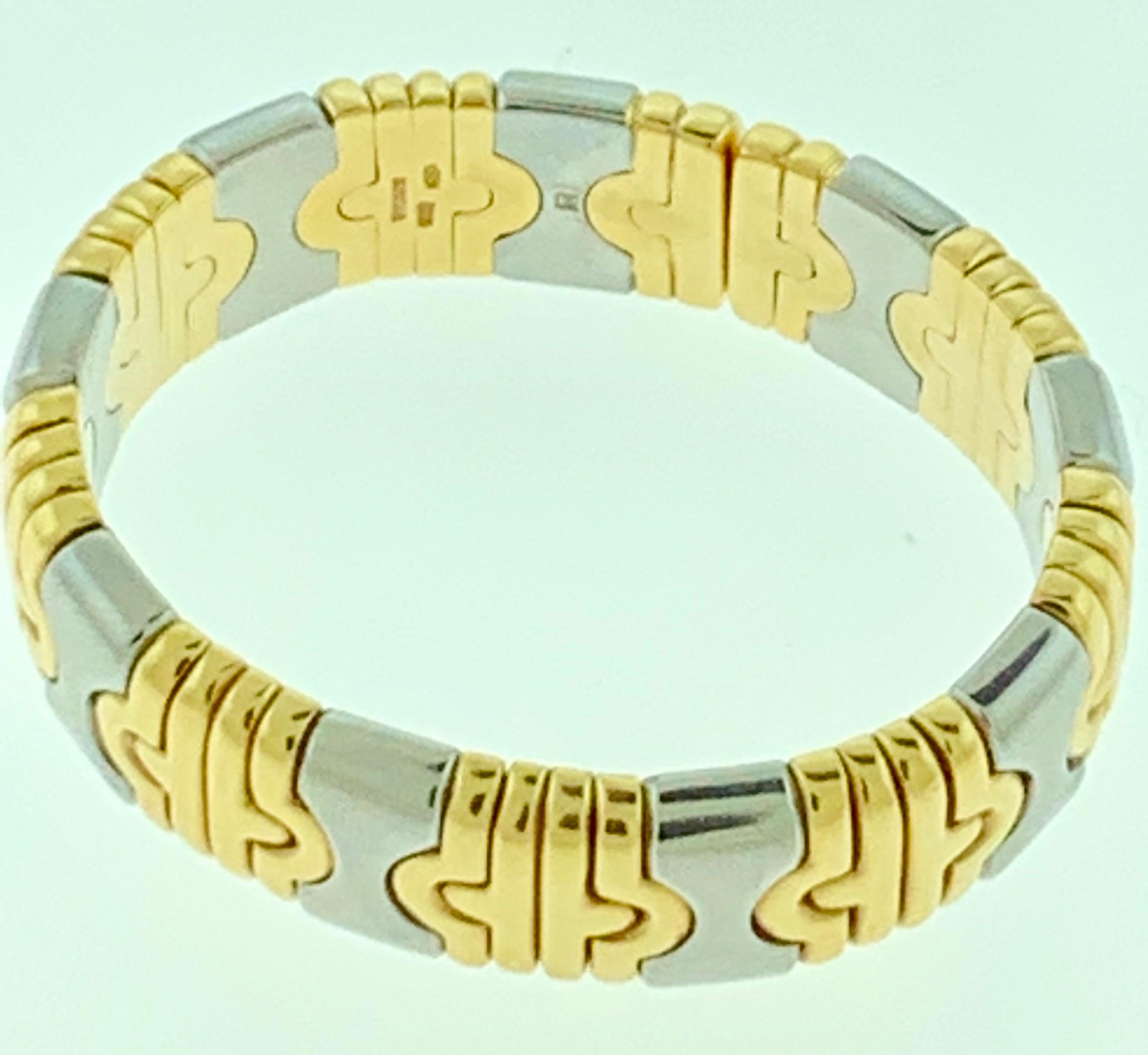 Multi-gold Parentesi Cuff 18k Yellow & White Gold 15mm Bracelet in two Tone

Style: Bvlgari Parentesi Two Tone Cuff Bracelet
Metal: 18 K Yellow Gold & Stainless Steel
Size: Inside Circumference 6 inches, Fits very small wrist
Left to Right: 2.2