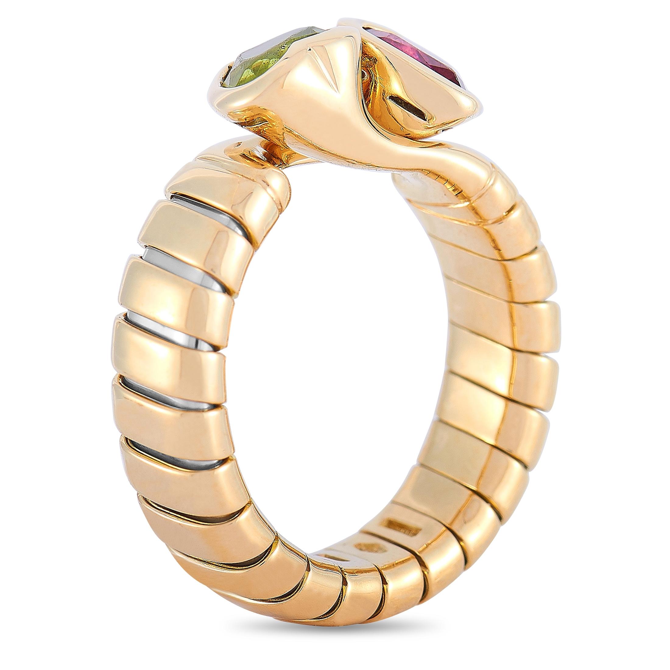 This Bvlgari ring is made of 18K yellow gold and embellished with a tourmaline and a peridot. The ring weighs 7.7 grams and boasts band thickness of 5 mm and top height of 5 mm, while top dimensions measure 12 by 9 mm.
 
 Offered in estate