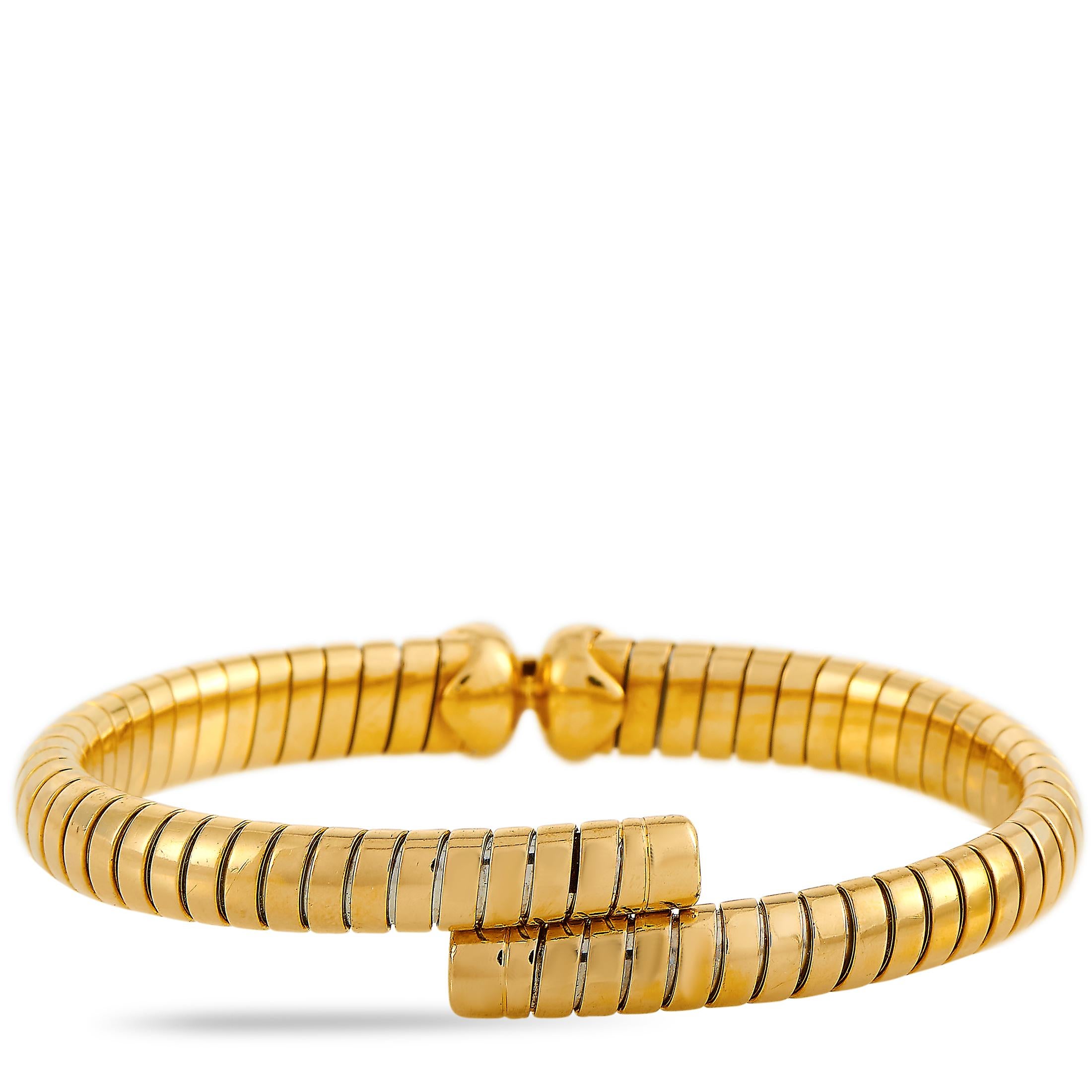 This Bvlgari tubogas bracelet is crafted from 18K yellow gold and weighs 31.1 grams. It measures 7.85” in length and boasts a 2.50” diameter.

The bracelet is offered in estate condition and includes the manufacturer’s box.