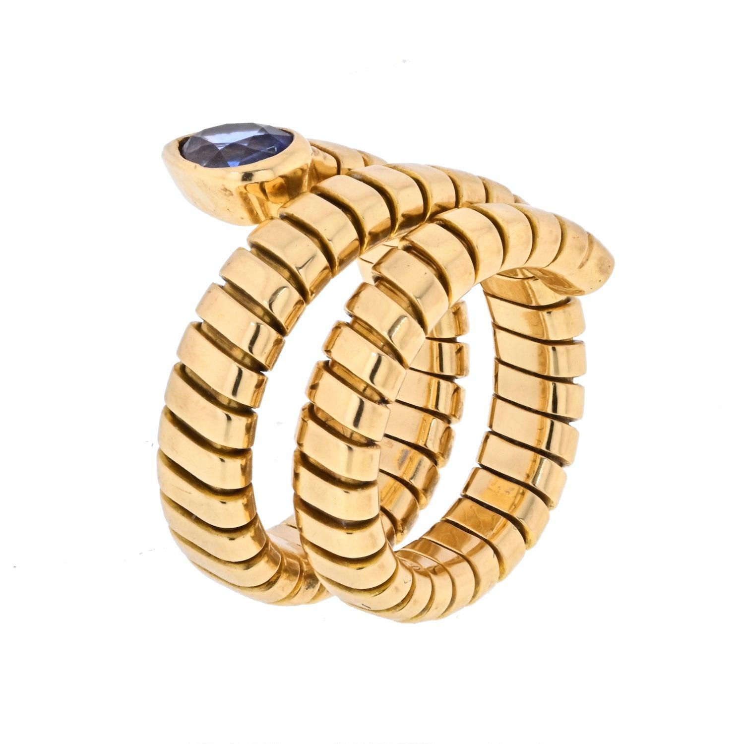 Lovely Bvlgari 18K Yellow Gold Tubogas ring with a blue sapphire ring.
A classic that will be your favorite in the jewelry box. Match it with your other tubogas items. 
Size 6.