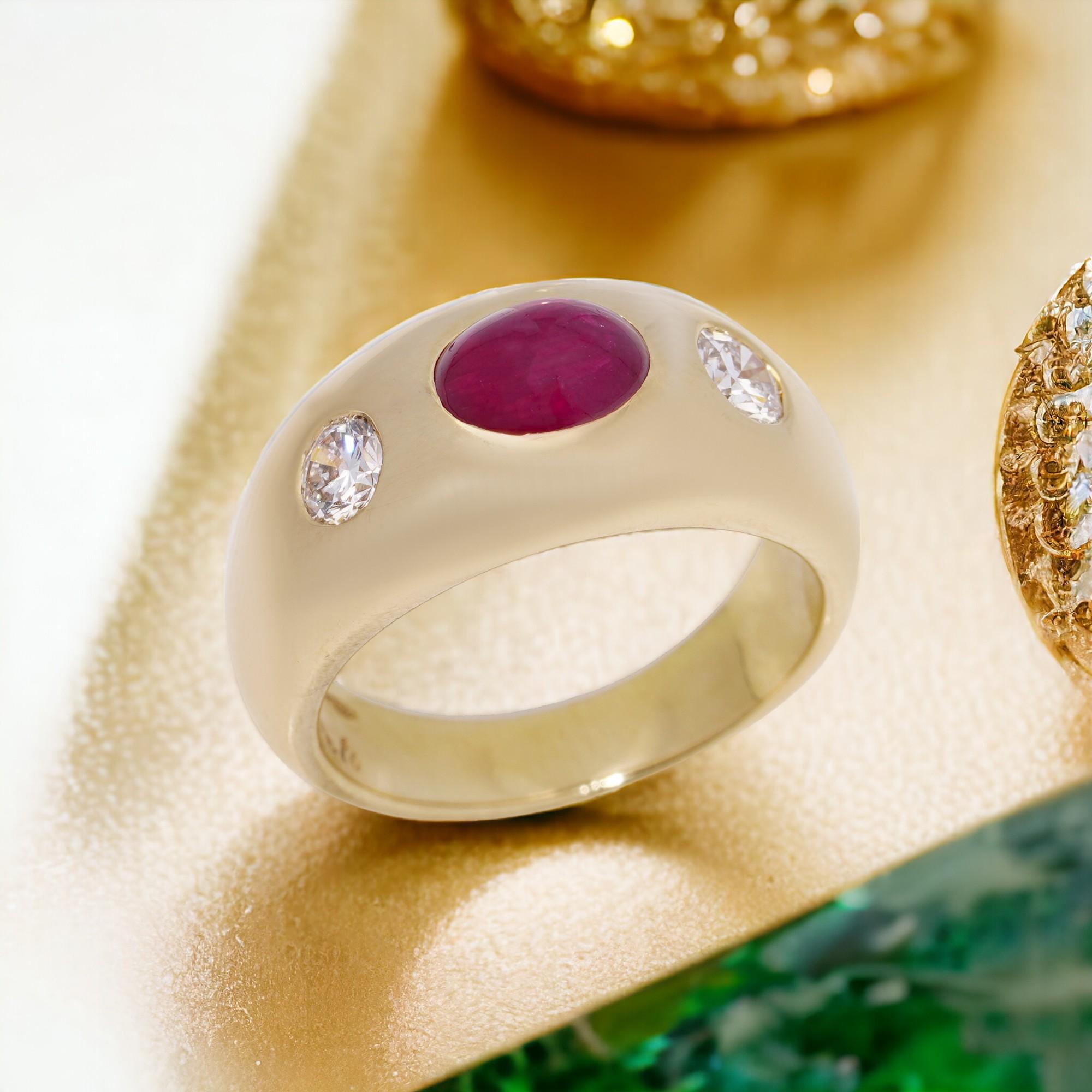 Bvlgari 18kt. yellow gold three stone ring, set with oval 1.29 cts. of Natural Burma cabochon ruby and 0.40 cts. of round Old-European cut diamonds. 
Made in Italy, Circa 1940 - 1950's  
Fully hallmarked. 

Dimensions -
Finger Size : (UK) = K (US) =