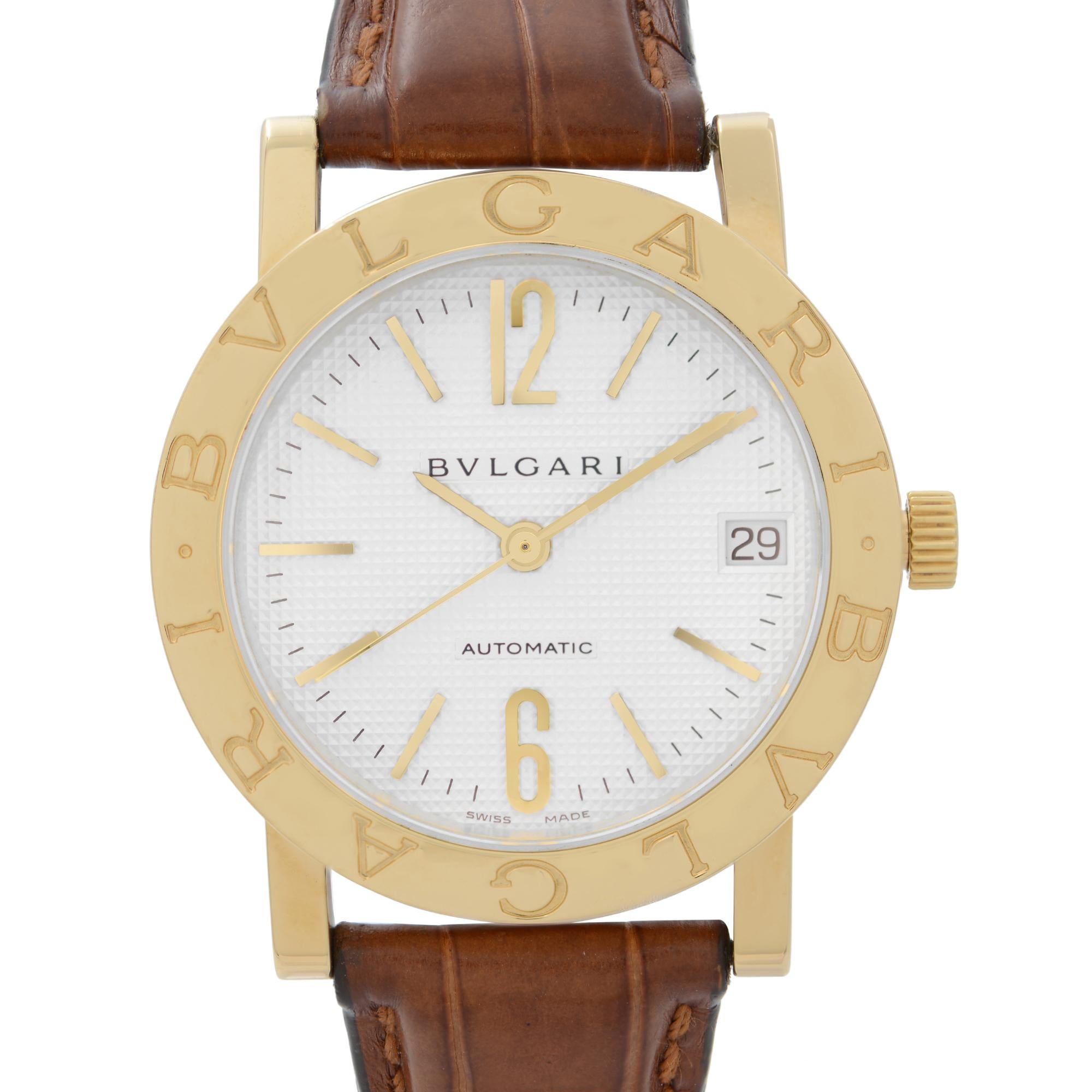 Pre Owned Bvlgari 18k Yellow Gold White Dial Leather Strap Automatic Watch BB33GL. This Beautiful Timepiece is Powered by Mechanical (Automatic) Movement And Features: Round 18k Gold Case with a Brown Leather Strap, Fixed 18k Gold Bezel with Bvlgari