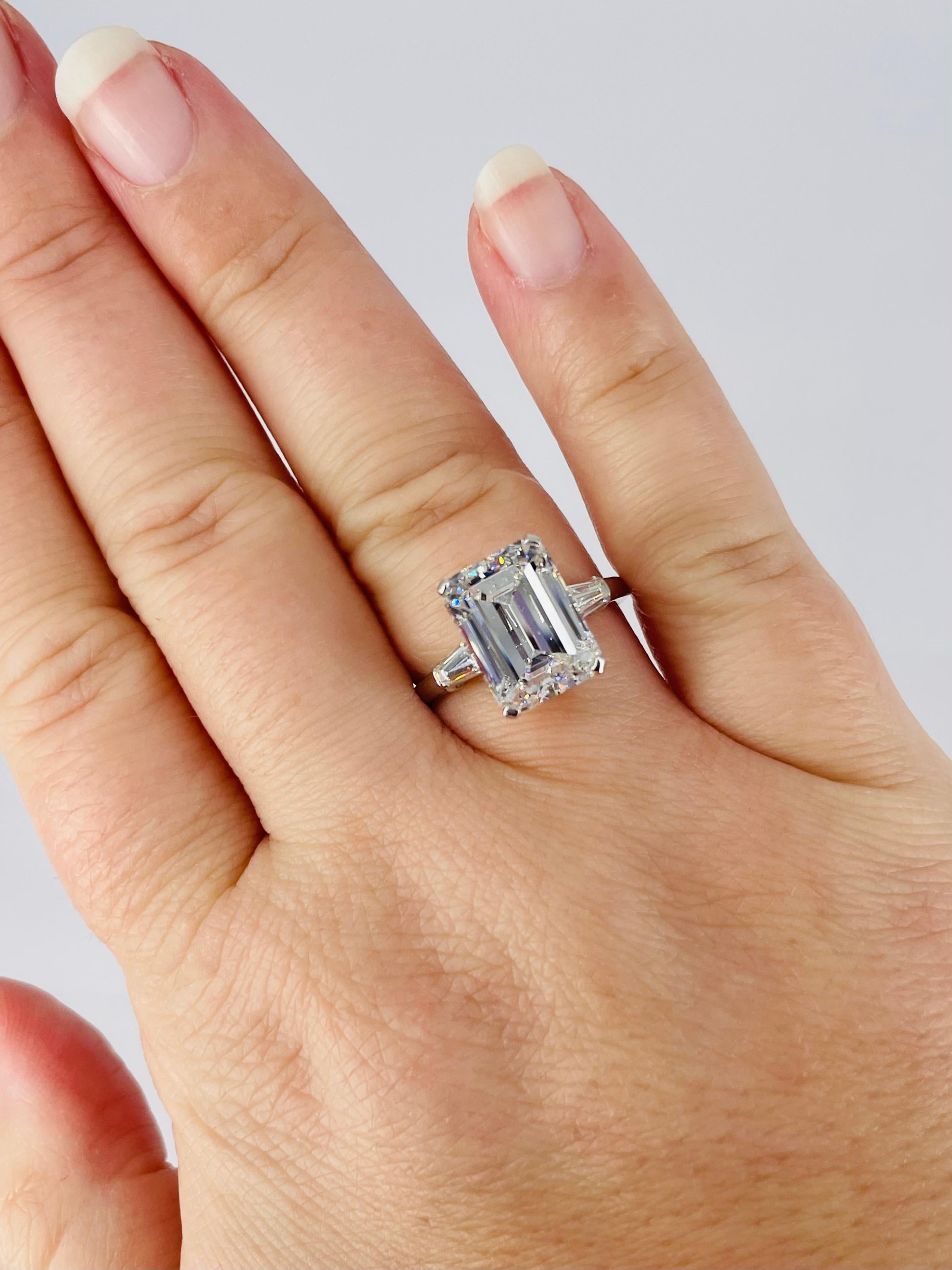 This timeless piece by Bulgari features a 4.98 carat emerald cut diamond, certified by GIA as H color and VVS2 clarity. It is accented by petite tapered baguettes that draw  the eye to the center diamond, and the setting is crafted in platinum. The