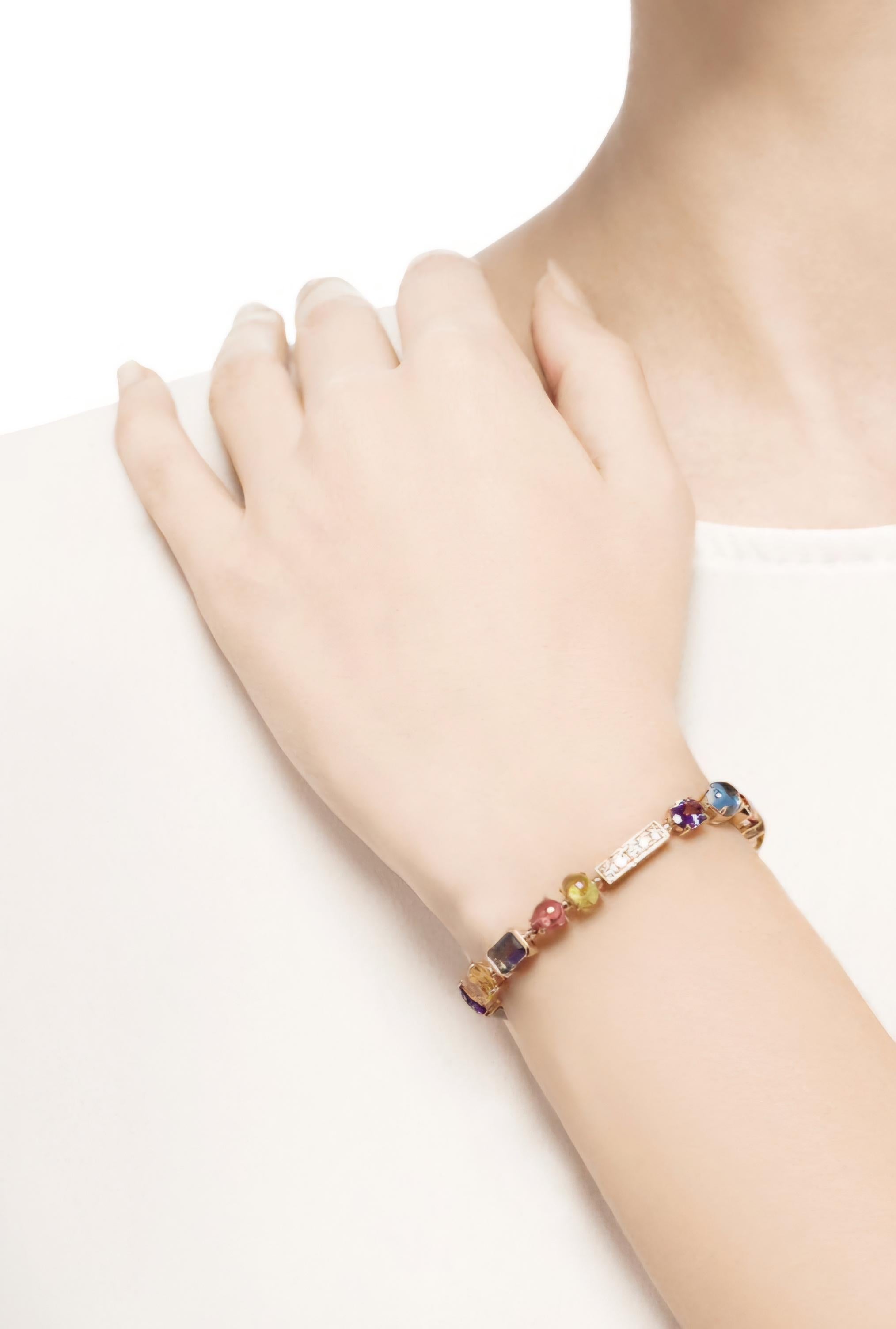 BVLGARI Allegra Armband aus 18 Karat Gelbgold, Farbsteinen und Diamanten. 
Zustand: sehr gut (sehr geringe Abnutzung).
Gewicht des Diamanten: 1,17 Karat.
Länge: 17 cm.
Breite: 6 mm.
Gewicht : 18.10 gr.
Farbige Steine: Amethyst, Turmalin, Citrin,