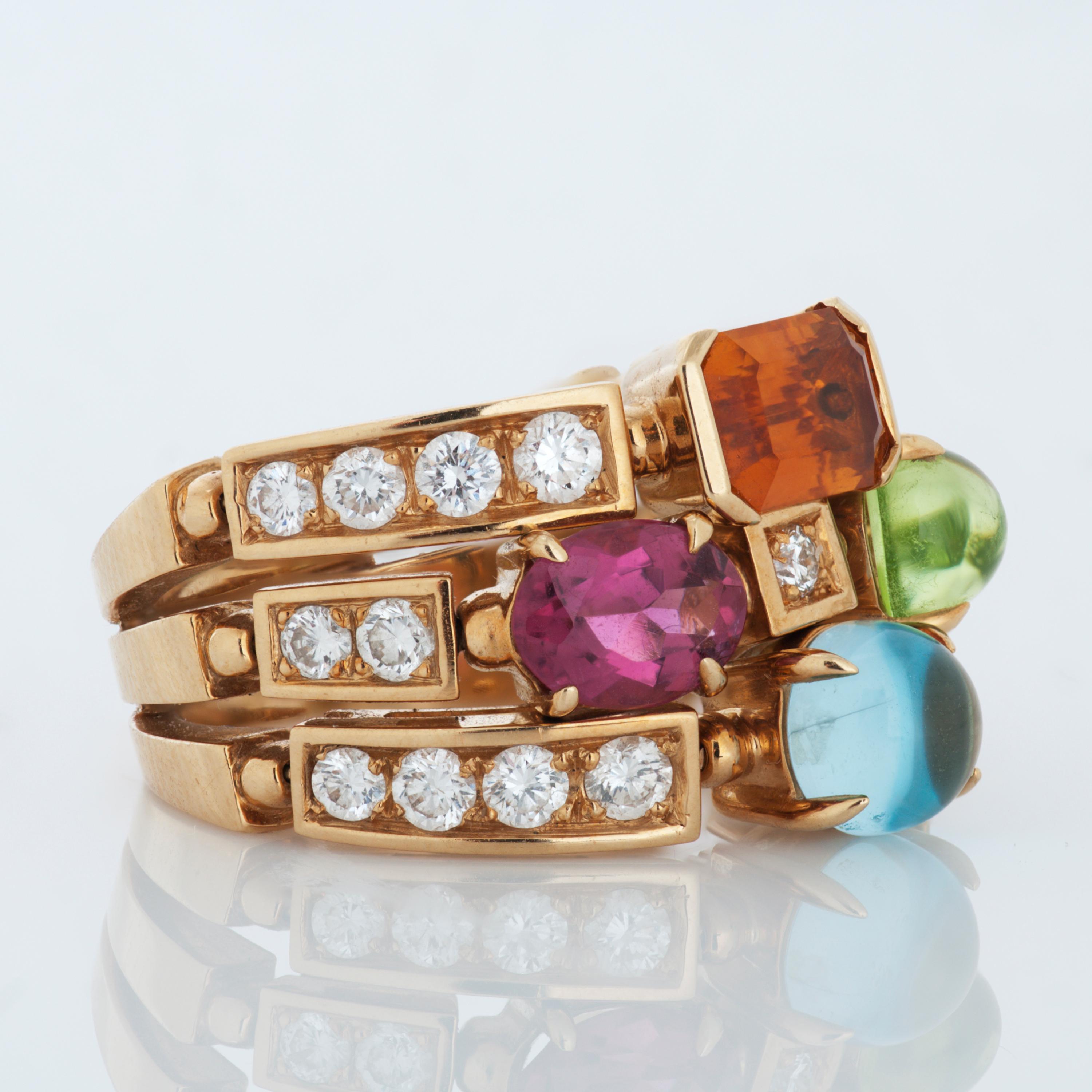 Bvlgari Allegra diamond and multi-gemstone ring in 18k yellow gold, accompanied by Bvlgari box. 

This Bvlgari ring features 1 round cabochon blue topaz, 1 pear shape cabochon peridot, 1 faceted oval pink tourmaline and 1 step cut citrine, as well