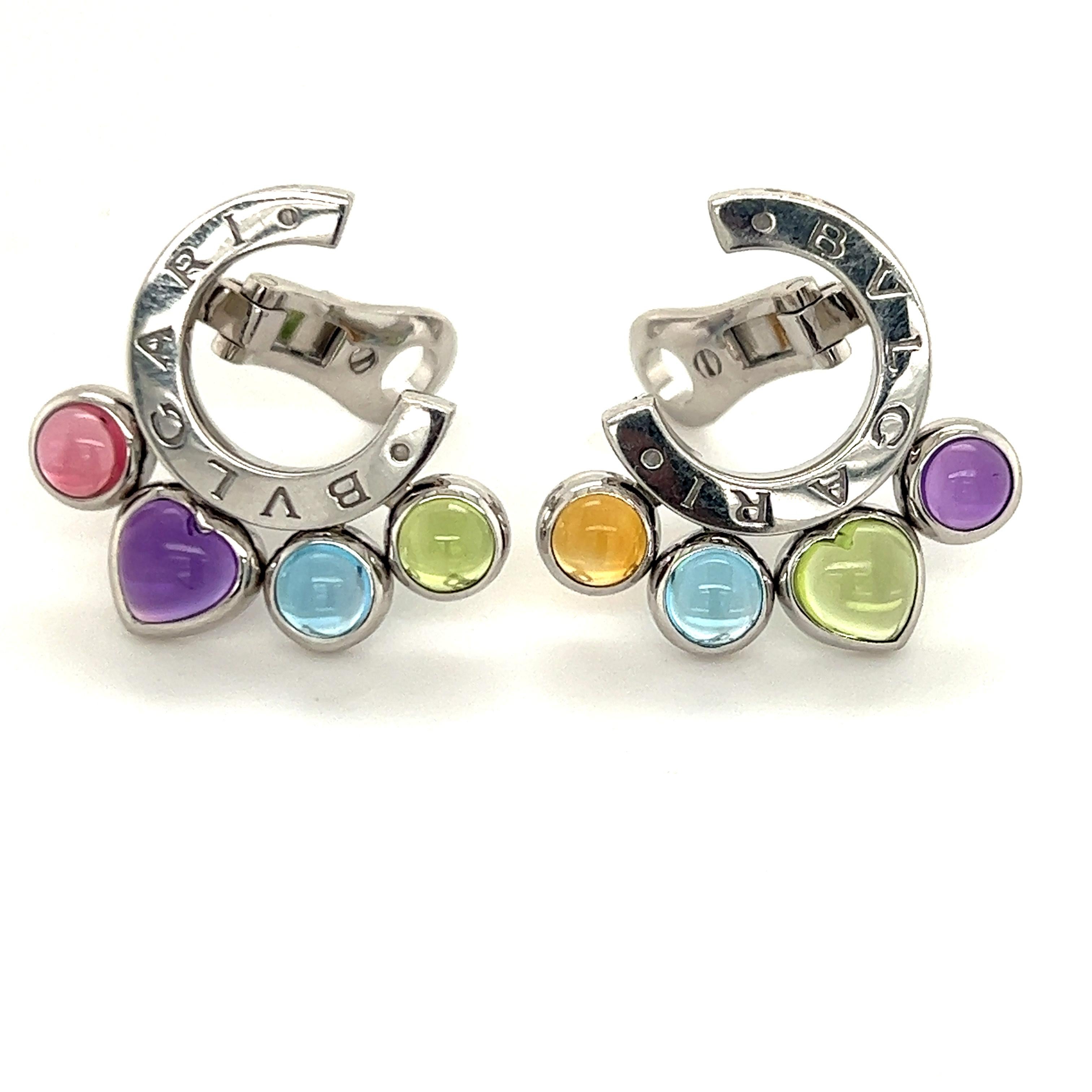 Pair of beautiful earrings crafted by famed designer Bvlgari. The earrings are from the Allegra collection and pop with vibrant colors. The pair is crafted in 18k white gold and show a high polished half circle engraved Bvlgari. Each earring has 4