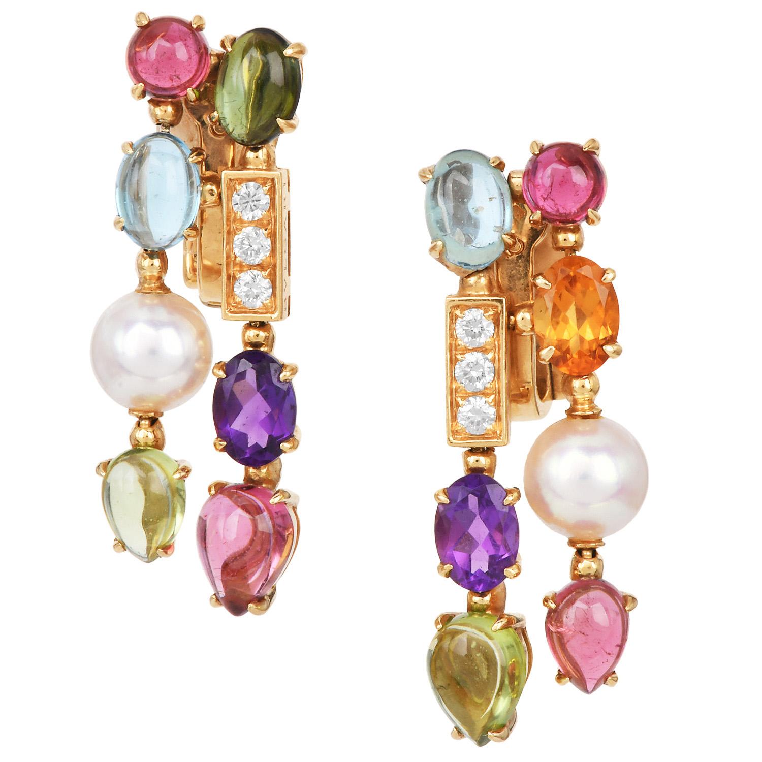From Bvlgari’s vibrant Allegra collection, these drop earrings are crafted in 18K yellow gold and set with colorful gemstones. Featuring faceted amethyst and citrine, pear-shaped peridot cabochons, oval topaz, and a mix of oval and pear-shaped
