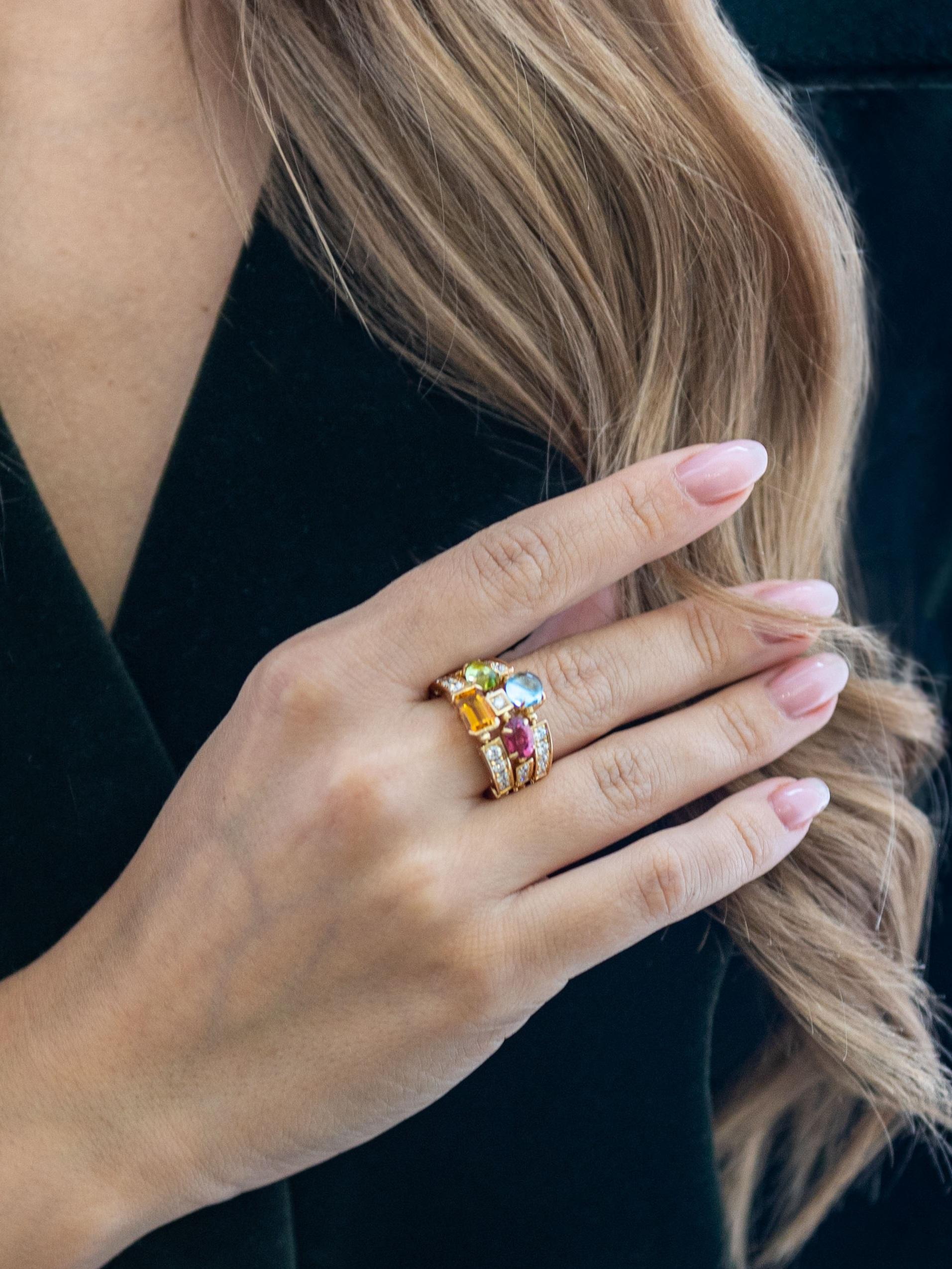 BVLGARI Allegra ring in 18k yellow gold, colored stones and diamonds. 
Condition: excellent. 
Size: 52.5 - 53  (US equivalent 6.25 - 6.5).
Diamond weight: 1.10 carat.
Stones: peridot, citrine, tourmaline, blue topaz, prasiolite, amethyst.
Width: 1.5