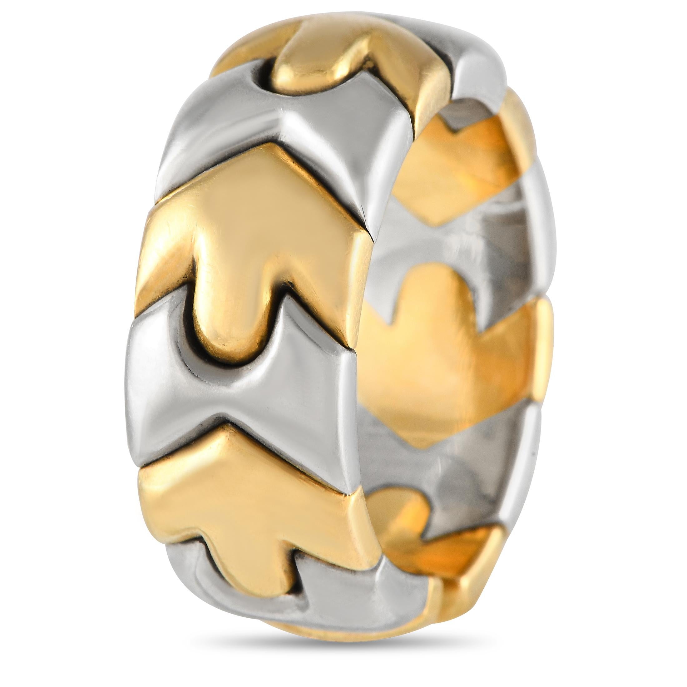 A finely crafted geometric ring from Bvlgari. This classic piece features an interlocking pattern of graphic motifs in stainless steel and 18K yellow gold. The ring's top dimensions measure 17mm by 7mm.This size 6.0 Bvlgari Alveare 18K Yellow Gold