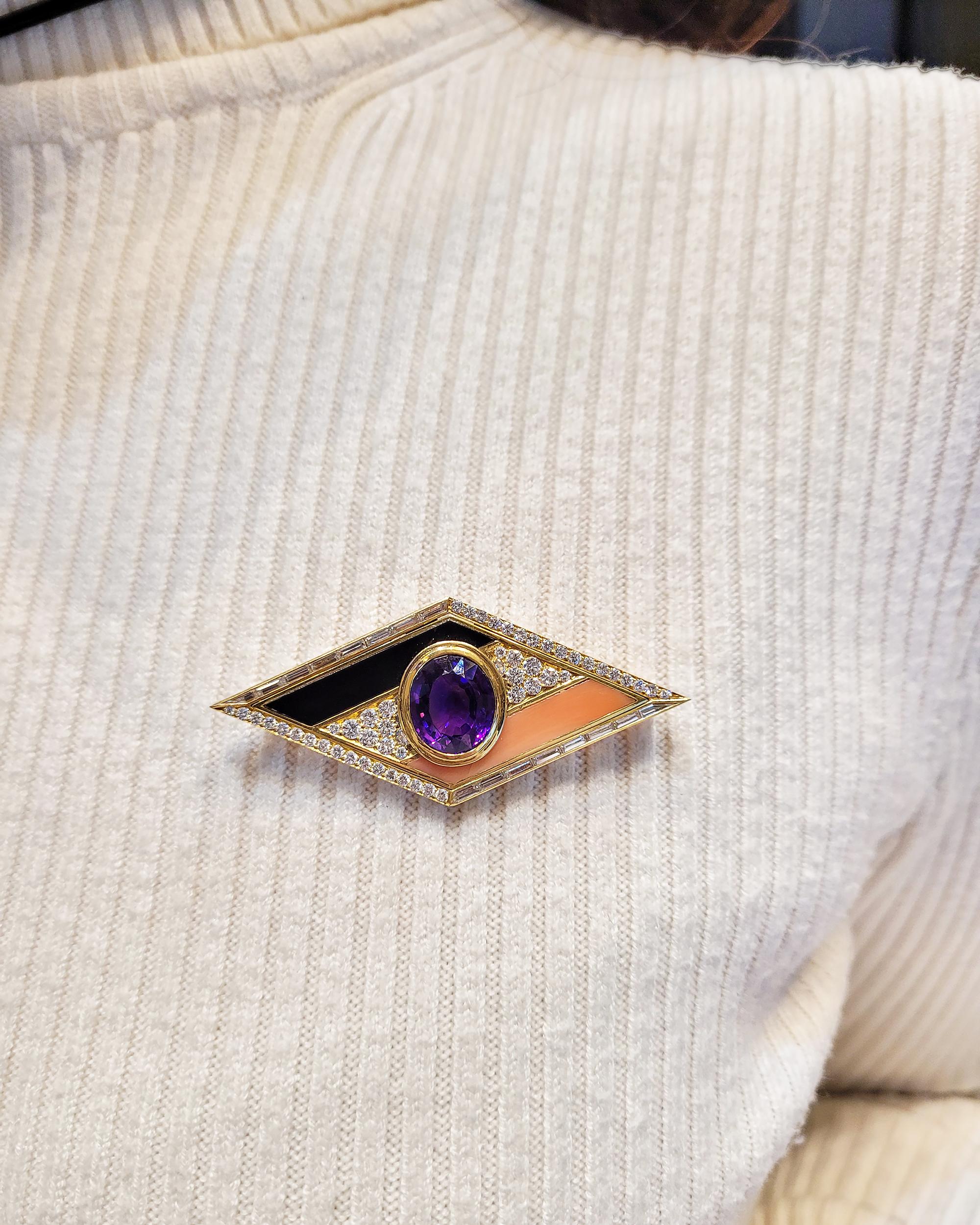 Enter the realm of exquisite craftsmanship with the Bvlgari Amethyst and Diamond Brooch - a masterpiece that seamlessly marries the allure of gemstones with the sophistication of fine jewelry. Crafted in the radiance of 18k yellow gold, this brooch