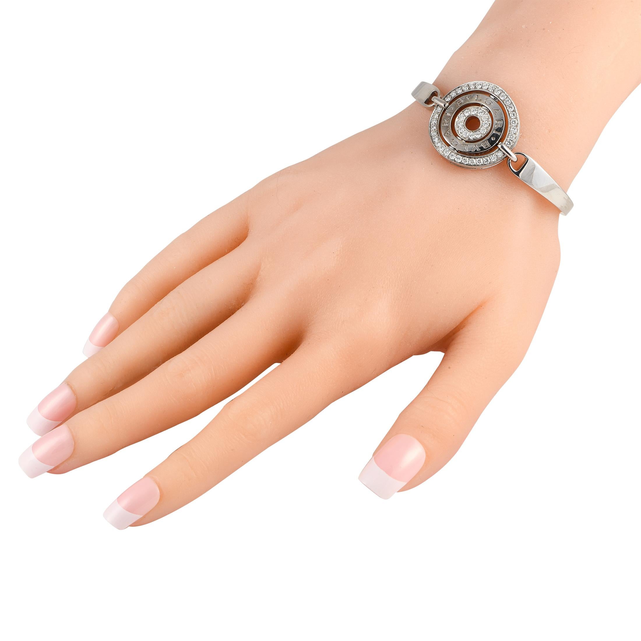 This Bvlgari Astrale Cerchi bracelet is a luxury piece with an iconic sense of style. At the center of this pieces sleek 18K White Gold setting, youll find a circular centerpiece featuring the brands signature and sparkling Diamonds totaling 1.40