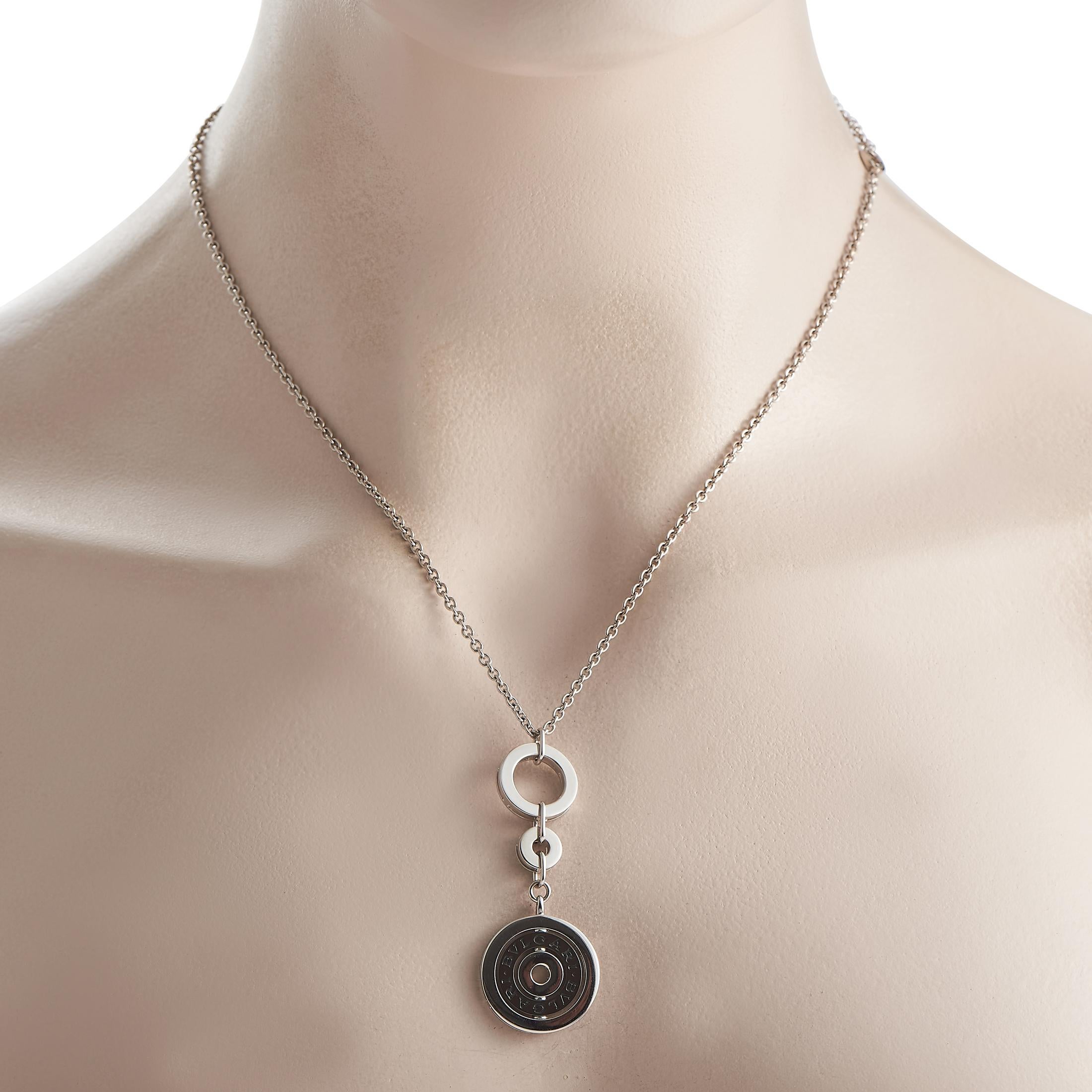 This solid 18K white gold necklace is a signed and hallmarked rare, vintage piece from Bvlgari's Astrale Cerchi collection. Inspired by the night sky, the necklace features three white gold circles inspired by celestial spheres. The hoops vary in