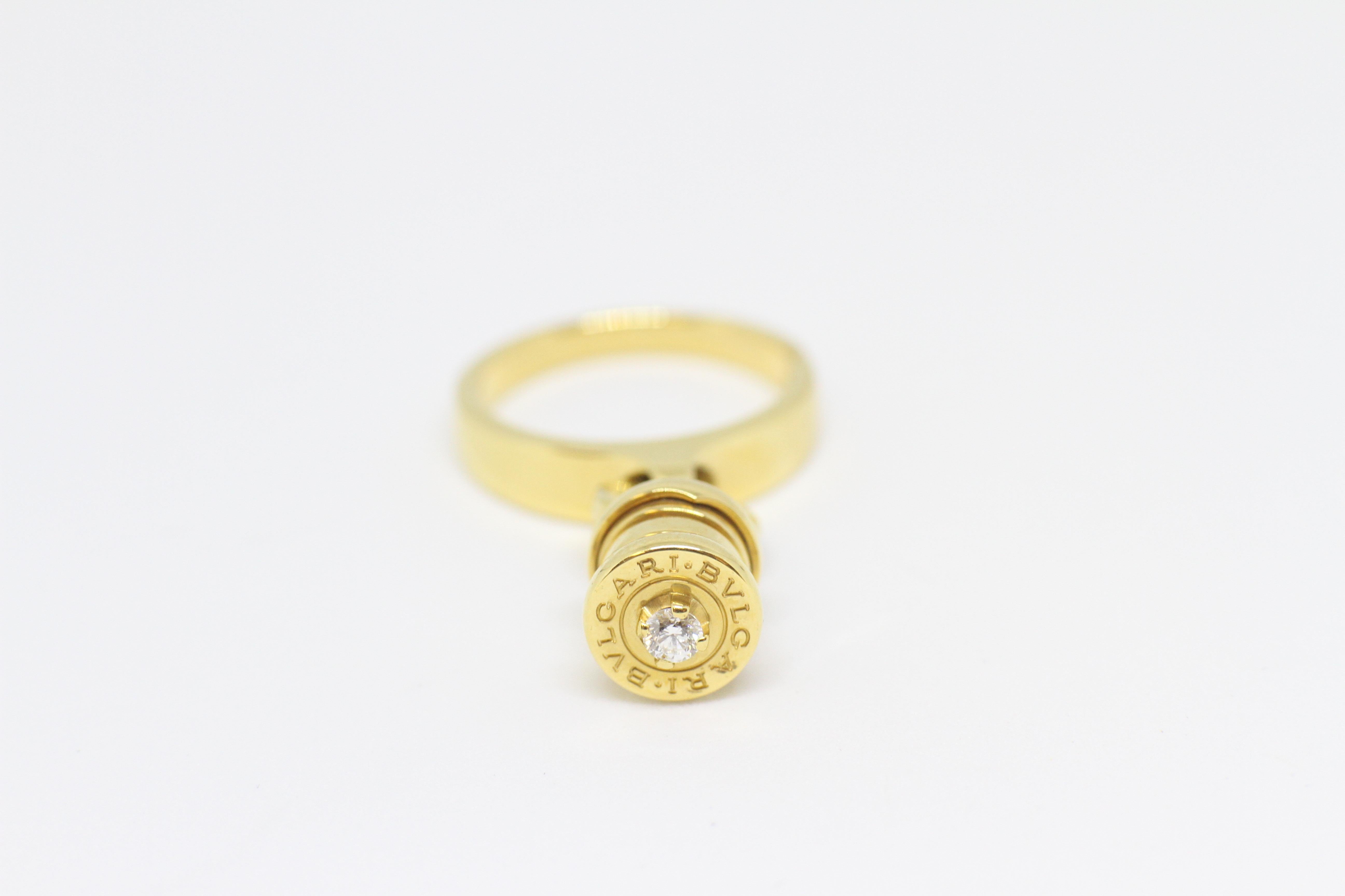 Bvlgari B-Zero 1 charm ring set with a brilliant cut diamond of approximately 0.04 carats in a four claw setting. Engraved Bvlgari on head of charm, link ring and band. Marked 18 carat yellow gold. Made in Italy. Uk finger size 'J'.

