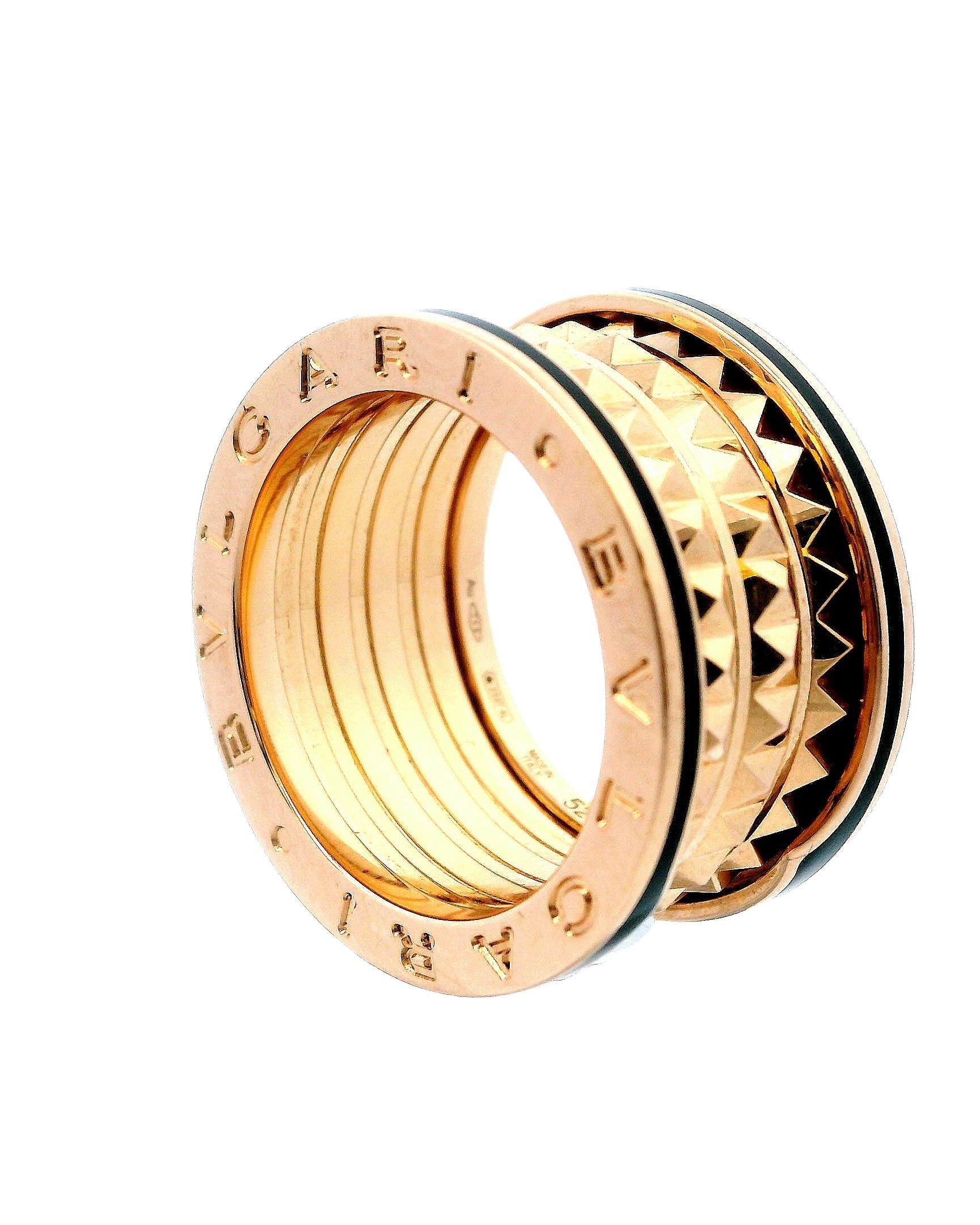 A bold interplay of texture and form.

This striking Bvlgari ring showcases a dynamic design with intricate geometric patterns. Crafted in luxurious 18k rose gold, the piece features a series of pyramid-like studs encircled by smooth, polished