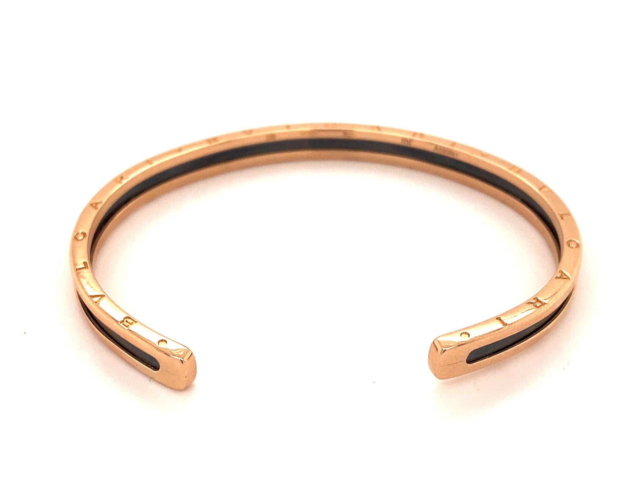This is an authentic 18k rose gold and stainless steel bangle bracelet.  The model is the B-Zero style with rose gold on the outside and black stainless steel on the inside. Bangle is marked Made in Italy Bvlgari and numbered A589N1.  Bangle