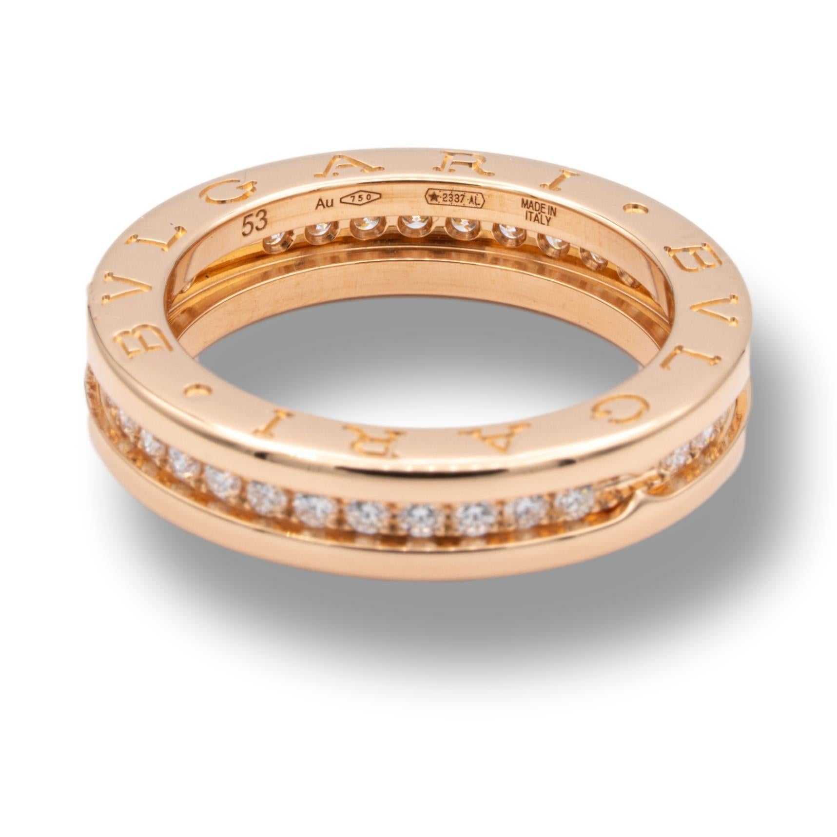 Bvlgari B-Zero band ring from the Labyrinth collection finely crafted in 18 karat rose and white gold studded with 1 row of bead set round brilliant cut diamonds weighing 0.48 carats total weight approximately. 

Made in Italy.

Stamp: BVLGARI 56