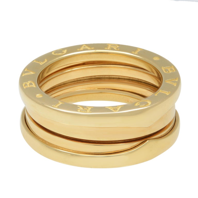 18k yellow gold band ring from Bvlgari  Bzero1 collection. This style is showcasing strong bold lines in solid yellow gold, engraved Bvlgari. Ring size 52 US 6. Width: 7.50mm. Thickness 2.80mm. Great pre-owned condition. Original box and papers are