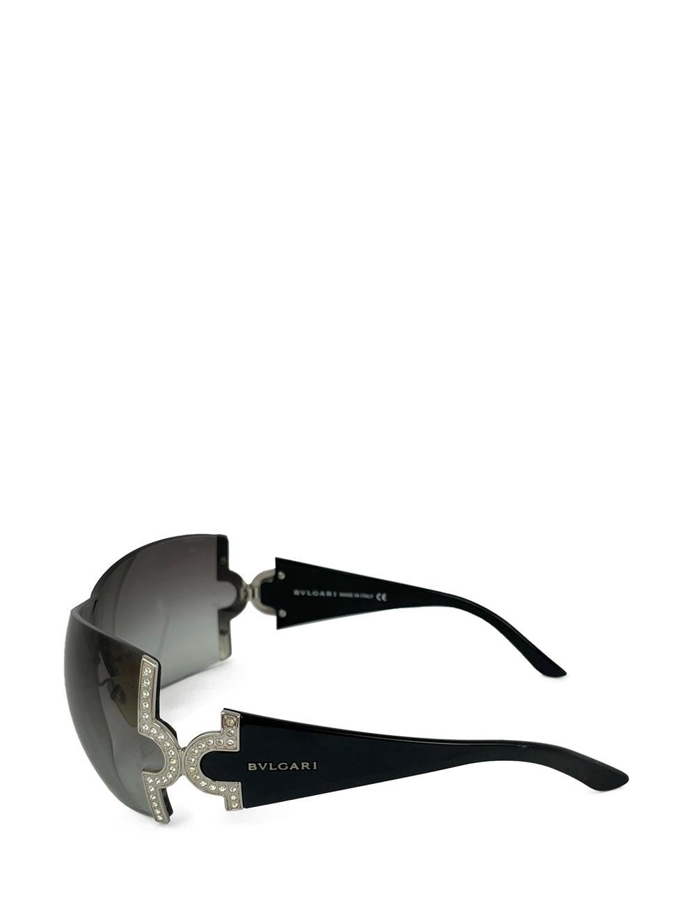 Black crytsal-studded face shield Bvlgari sunglasses.

Additional information:
Hardware: Acetate
Lens: Grey
Size: 51/18/125
Condition: In great condition.
Extras: Includes original box