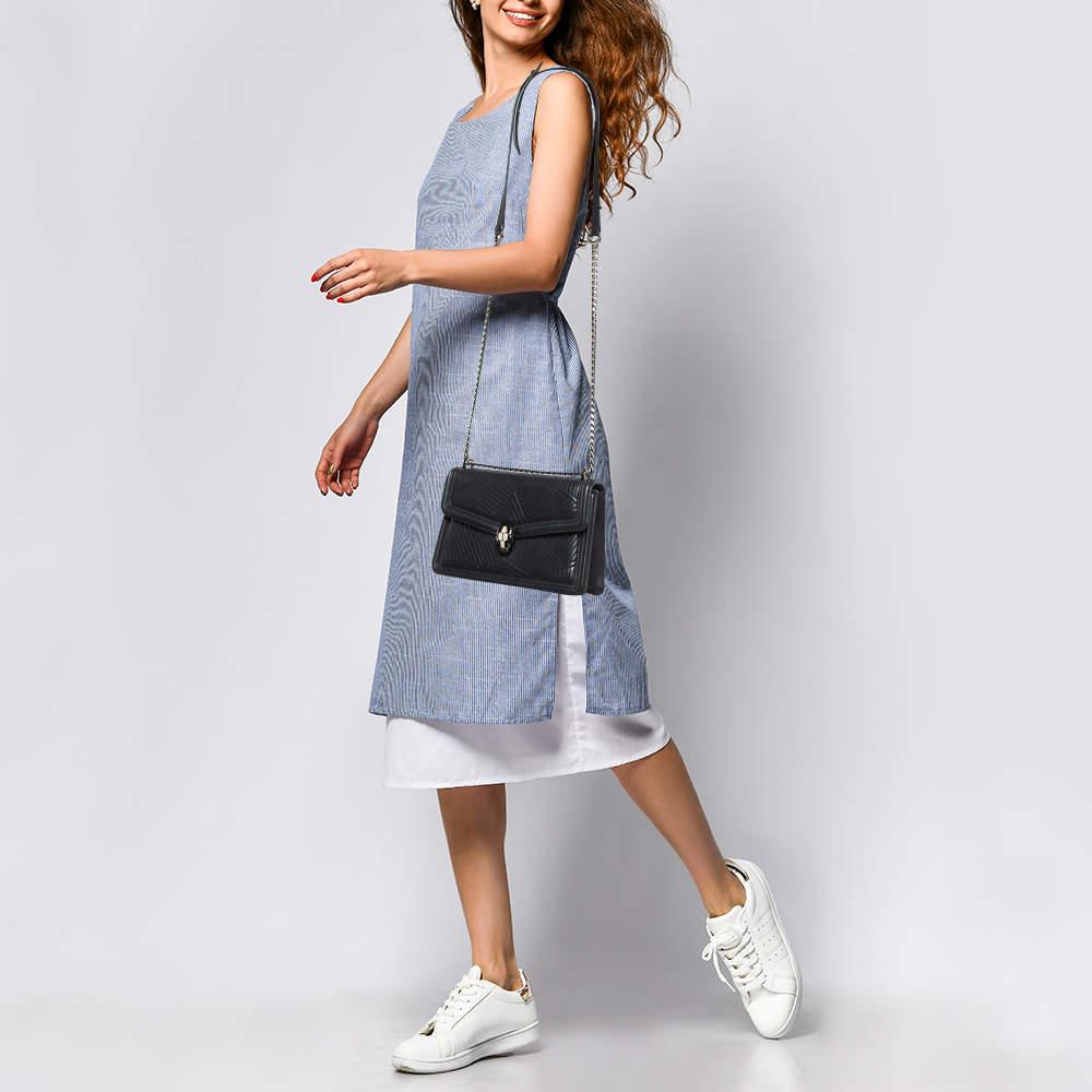 Most designs from Bvlgari with their striking elements pay tribute to the Roman roots and this bag is no different. Made from leather it is an accessory of utility and luxury. Perfectly sized the interior has enough room to dutifully store your