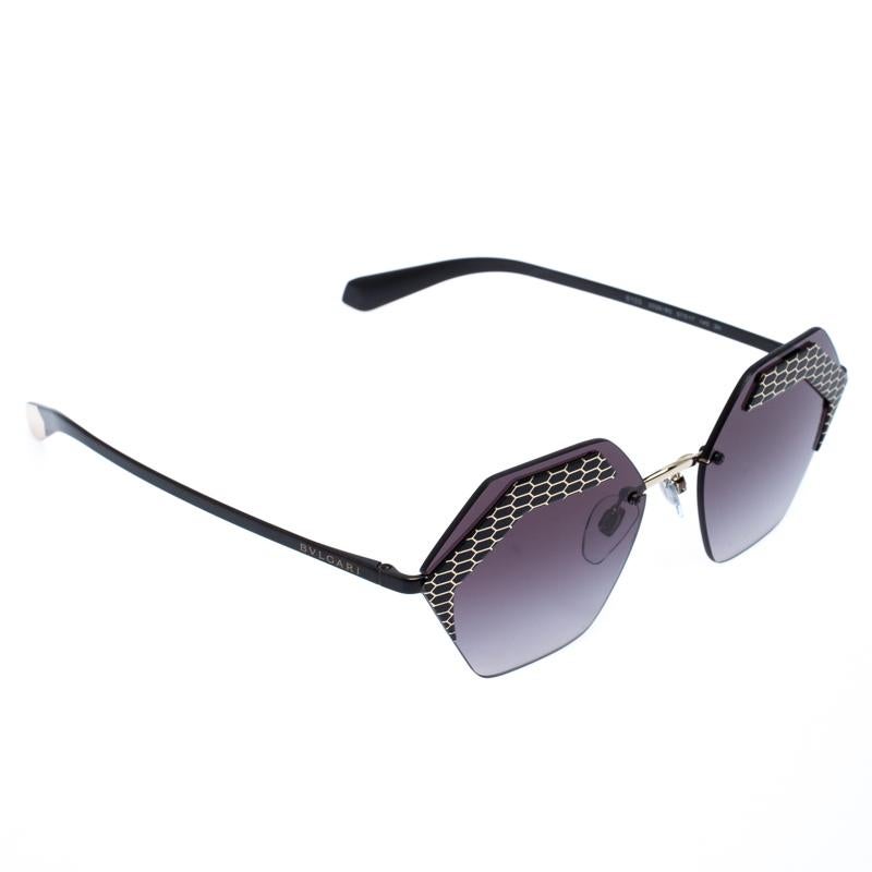 The stylish frames come from the house of Bvlgari and have been sculpted in acetate and metal to form a geometric shape and feature Serpenti accents on the front. They come with grey gradient lenses and black-tone hardware. They are finished with
