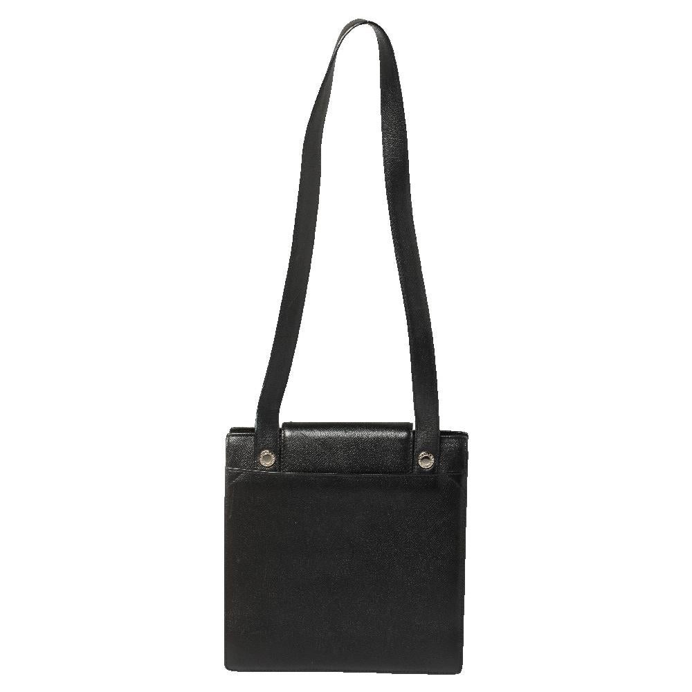 Bvlgari's immaculate craftsmanship and sophisticated designs combine to create this refined shoulder bag. Meant for you to carry all your essentials with ease, it is crafted from black-hued leather. The bag has a turn-lock on the flap, a shoulder