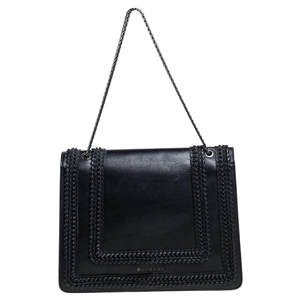 Dazzle the eyes that fall on you when you swing this stunning Bvlgari creation. Beautifully crafted in Italy from leather in an alluring black shade, the shoulder bag is styled with a flap that has the iconic Serpenti head closure- a long-standing