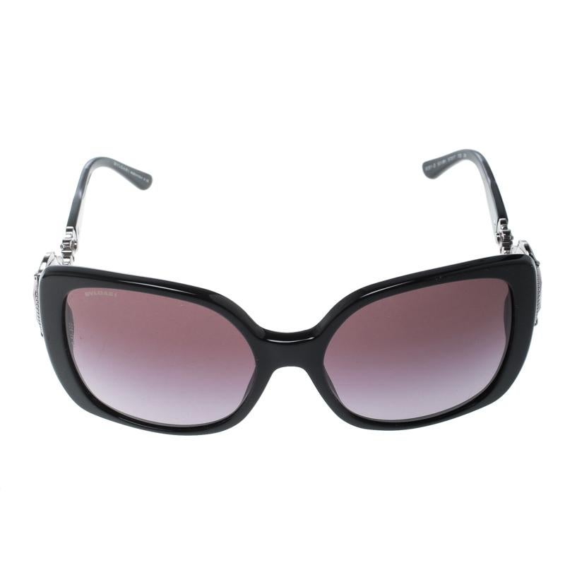 Add a glamorous detail to your special daytime wear looks by pairing them with this stunning Bvlgari oversized sunglasses. The black acetate frame is further enhanced with the silver-tone metal and crystal embellished design for an added dash of