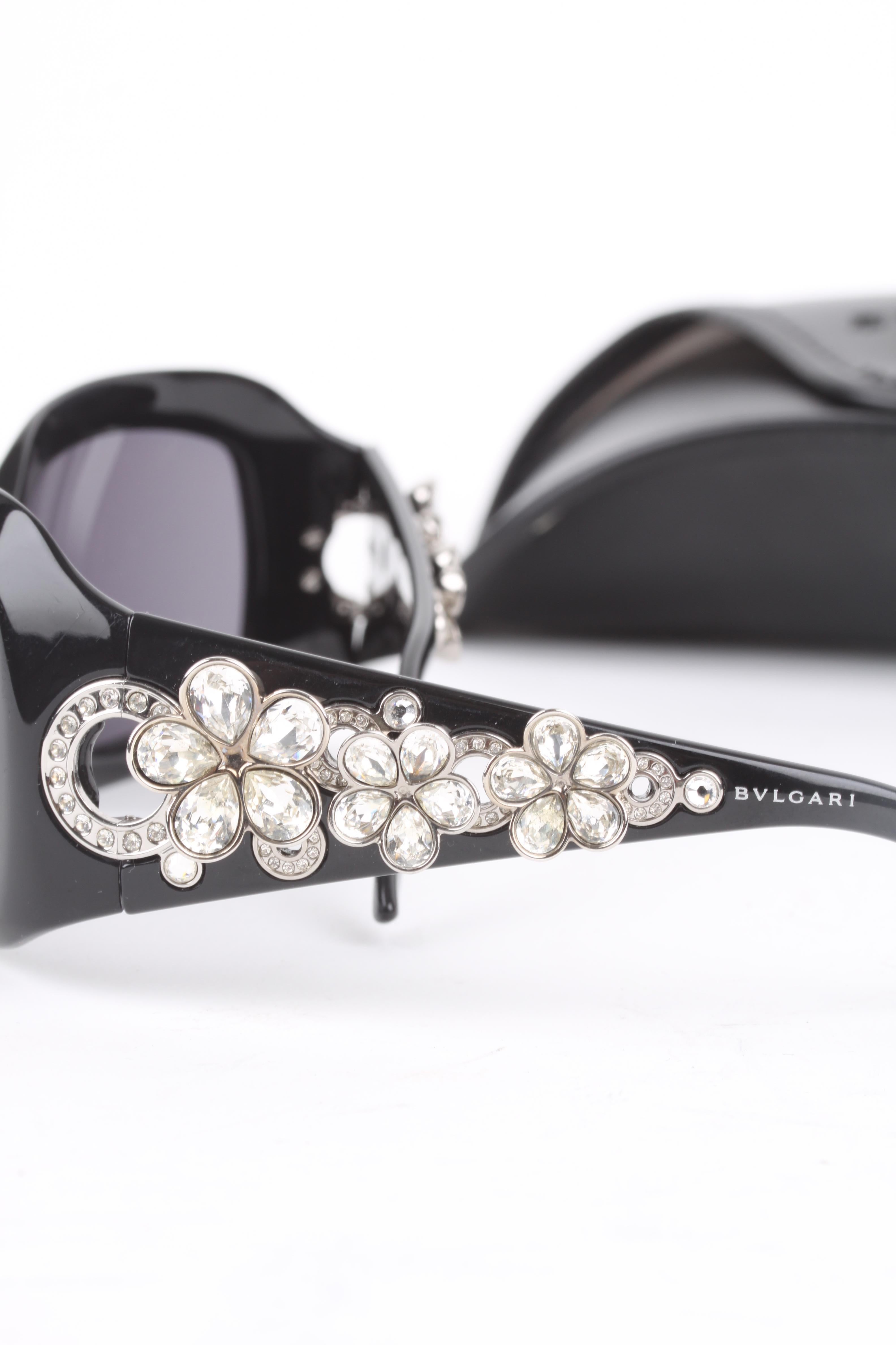 Bvlgari black swarovski crystal flower sunglasses.

Since 1884, Bulgari has been placing the pace for Italian style in jewellery. A ceativation spirit which never ceases to draw inspiration from the timeless beauty of Greek and Roman art, while