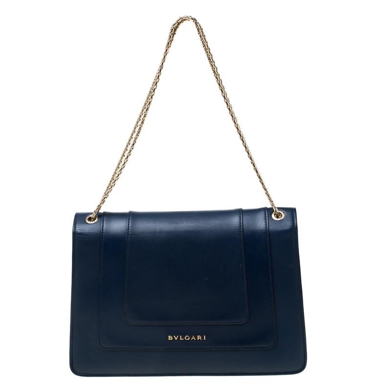 Dazzle the eyes that fall on you when you swing this stunning Bvlgari creation. Crafted from leather in a breathtaking blue, the shoulder bag is styled with a flap that has the iconic Serpenti head closure. The bag has a spacious leather interior