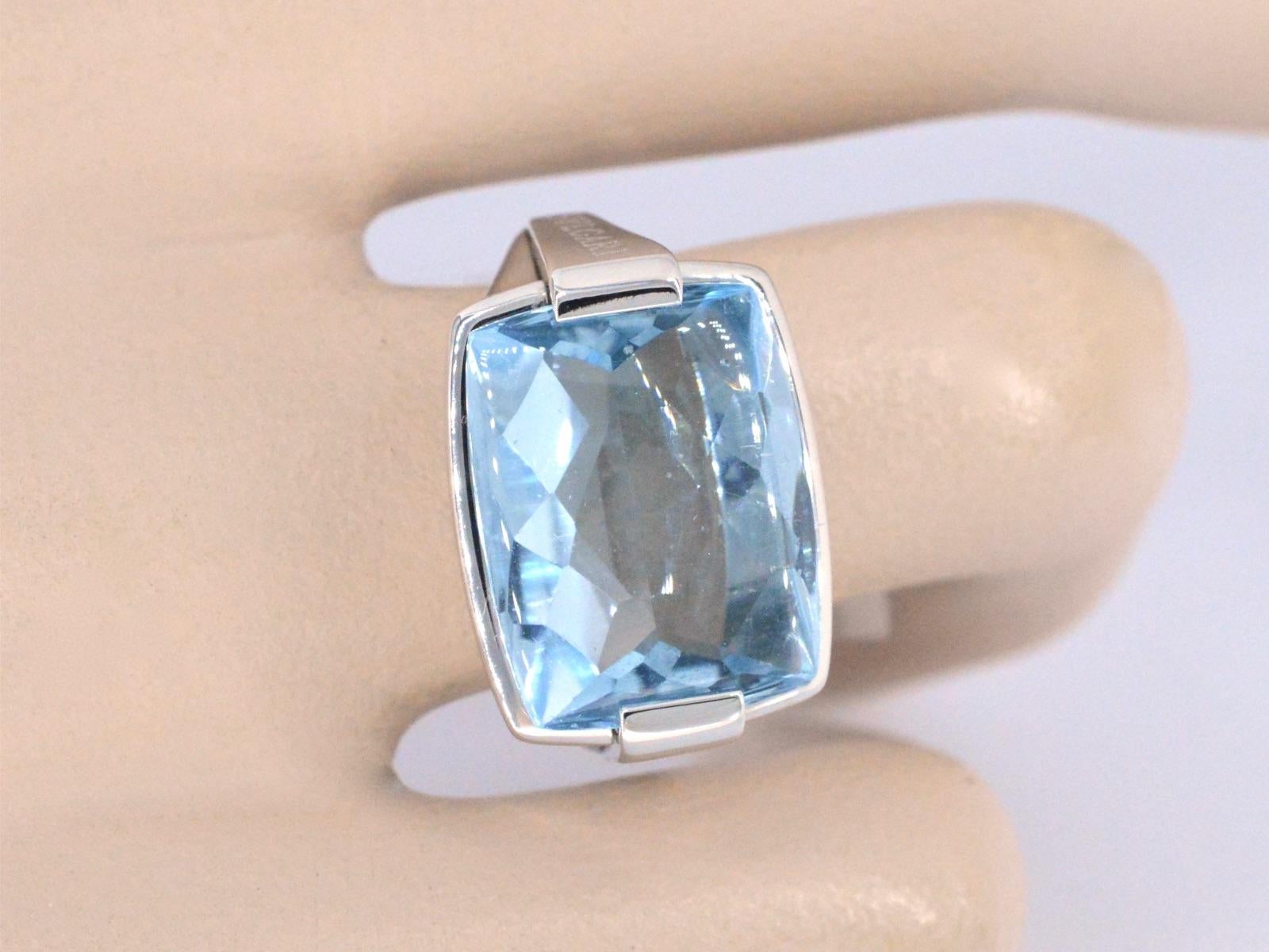 A stunning Bvlgari pyramid ring featuring a captivating blue topaz gemstone, measuring 12x15 mm. This exquisite cocktail ring, with its unique pyramid design, is a testament to Bvlgari's innovation in jewelry craftsmanship. Crafted from luxurious