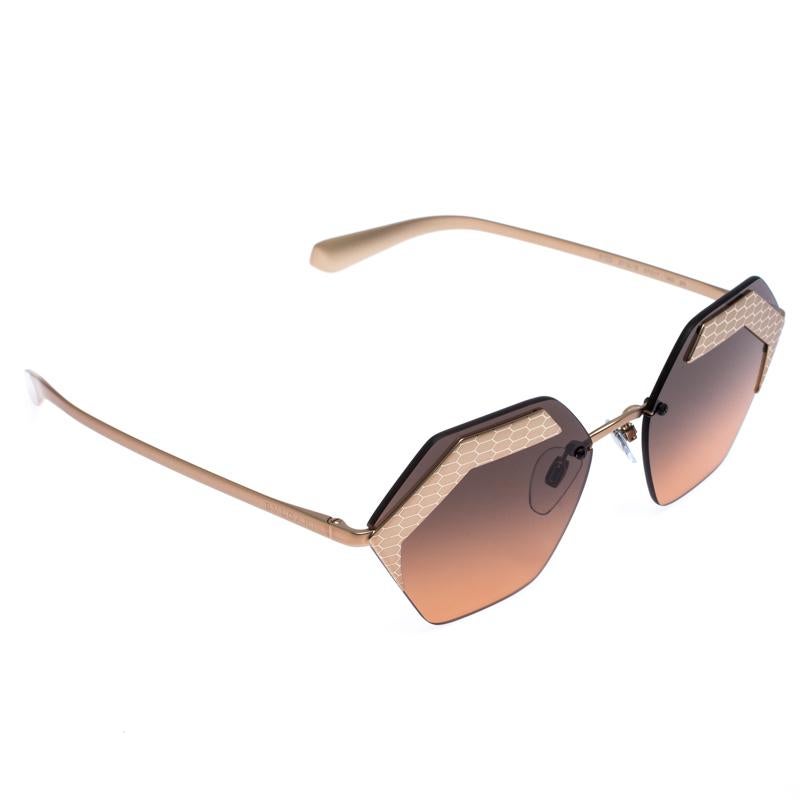 The stylish frames come from the house of Bvlgari and have been sculpted in acetate and metal to form a geometric shape and feature Serpenti accents on the front. They come with black gradient lenses and bronze-tone hardware. They are finished with