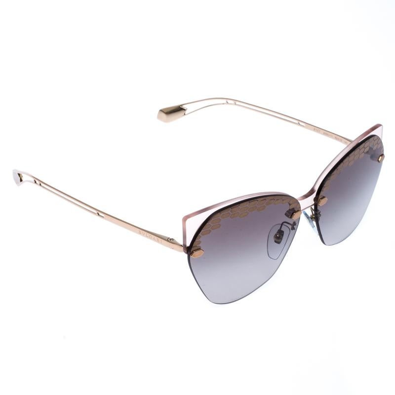 The stylish frames come from the house of Bvlgari and have been sculpted in acetate and metal to form a cat-eye shape and feature Serpenti accents on the front. Make these sunglasses a high-fashion accessory that you must own. They come with grey