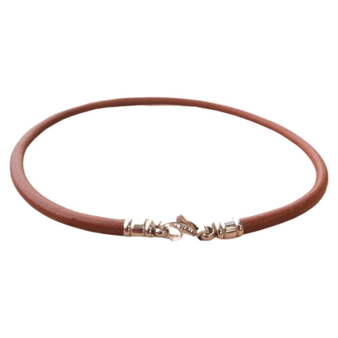Bvlgari brown leather cord choker necklace with stainless steel lobster claw clasp.

Stamped logo and manufacturer's mark on hardware.

Condition Details: Very good, gently used condition. No notable defects, though there are some signs of wear.
