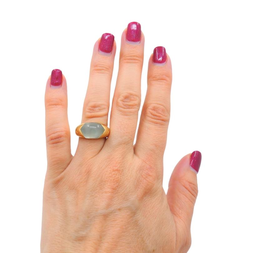 A Bulgari 18k gold ring, featuring an aquamarine. The ring is created in stylized Doppio Cuore design.
The gemstone set in a half dome style, offering translucent appearance and a subtle, soothing color that feels natural and understated. The band