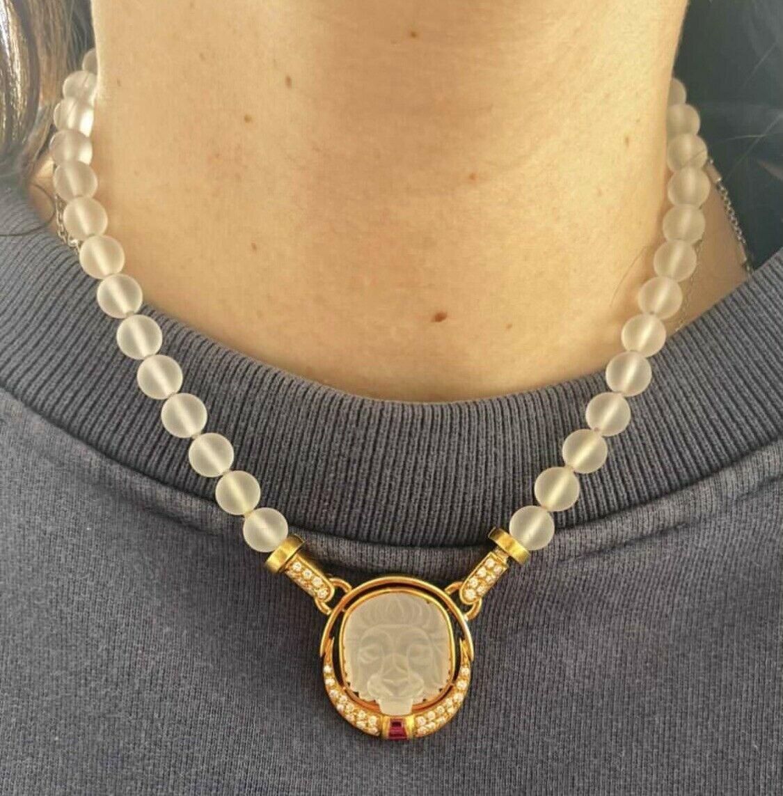 Bvlgari Bulgari 18k Yellow Gold, Rock Crystal, Ruby & Diamond Lion Necklace 1.15ctw

For sale is a Bvlgari 18k yellow gold diamond, ruby and rock crystal lion pendant necklace
 Perfect worn day or night.
 Get this stunning necklace now!
unclips to