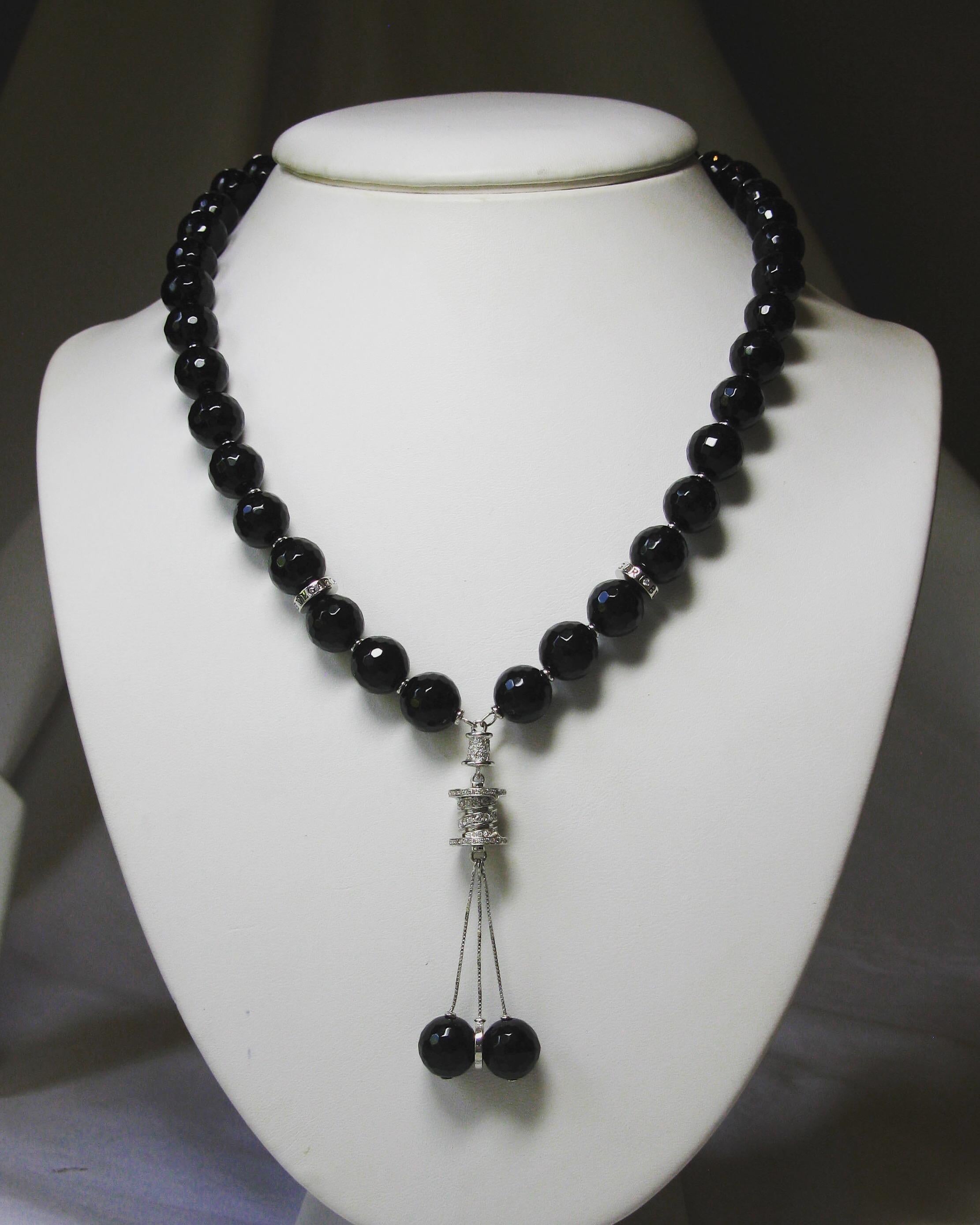 This is a gorgeous vintage Bvlgari, Bulgari B.zero necklace in the lariat style with faceted Black Onyx Beads and Diamonds in 18 Karat White Gold.  This Bvlgari necklace is an absolute stunner!  The necklace features faceted black onyx beads of