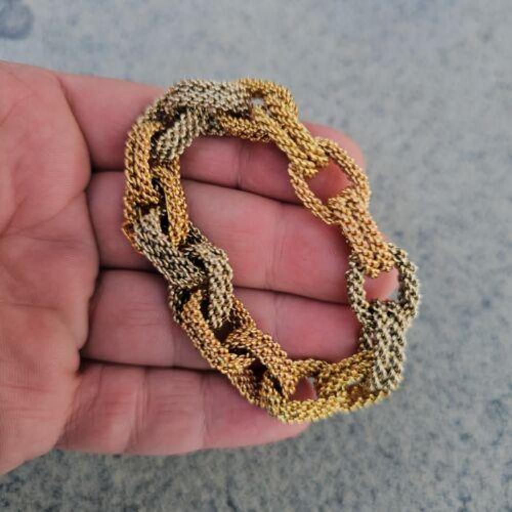 This vintage Bvlgari bracelet features a unique design with a cable weave link chain in 18k rose, white, and yellow gold alternating every 2 links. This Cable design is super unique and fun and very stylish for today's modern woman. The three colors