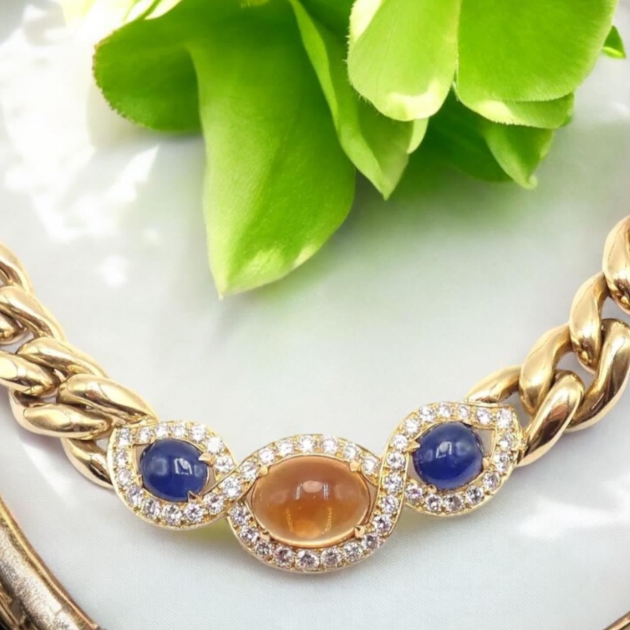 18k Yellow Gold Diamond Citrine And Sapphire Link Necklace by Bulgari. 
The Bvlgari 18k Yellow Gold Link Necklace features dazzling diamonds, vibrant citrines, and sapphires. 

This exquisite piece showcases Bvlgari's signature luxurious design,