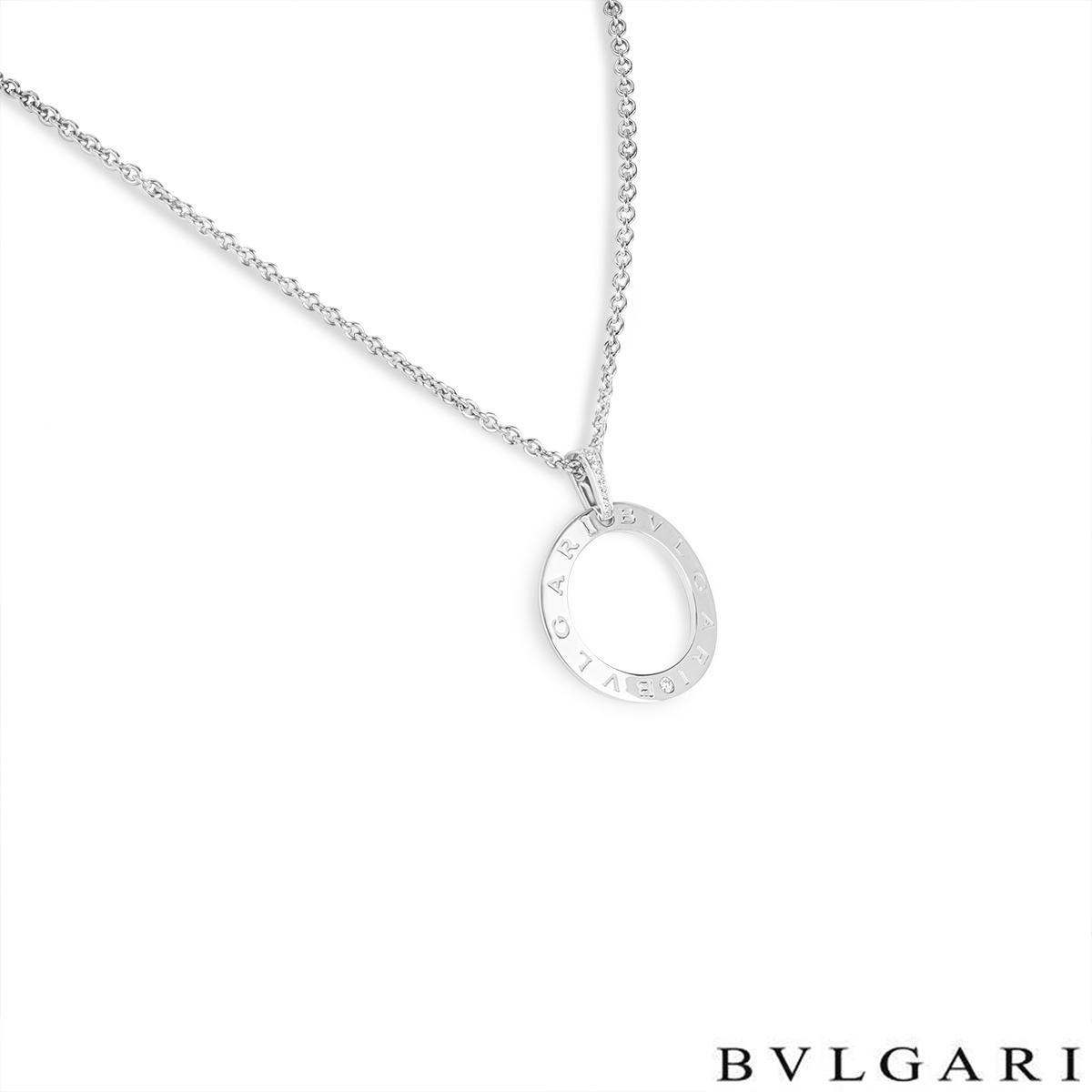A beautiful 18k white gold pendant by Bulgari from the Bvlgari Bvlgari collection. The pendant features a circular openwork motif engraved 'Bvlgari Bvlgari' around the outer edge separated by a single set diamond and a pave diamond set bail. The 10
