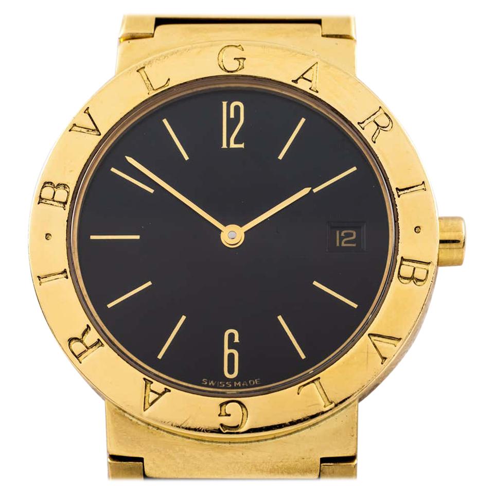 gold watch black face