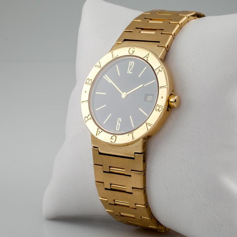 black face gold watch