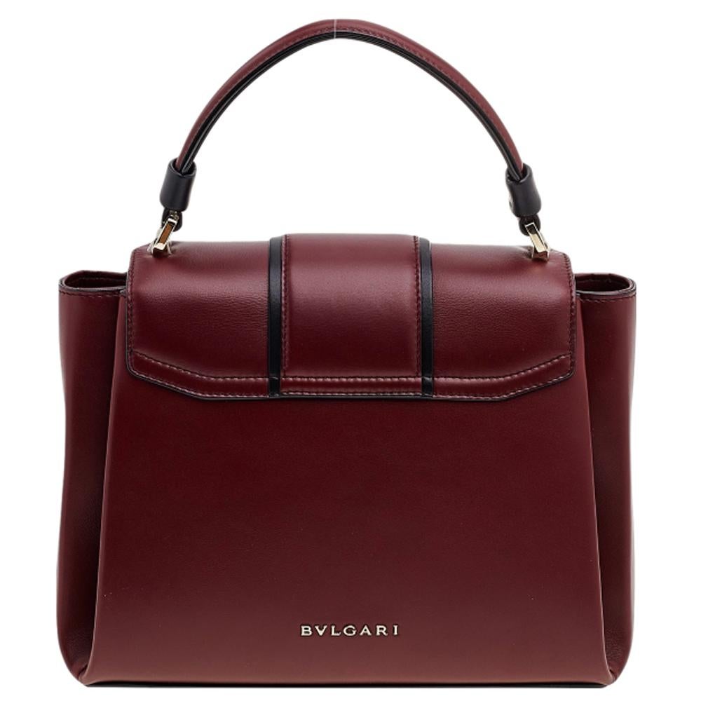 This beauty is from Bvlgari and it is a sight to behold! It is excellently crafted from leather and designed to catch the fancy of every handbag lover. The bag holds a stunning enamel lock on the flap. A well-sized interior and a top handle bring