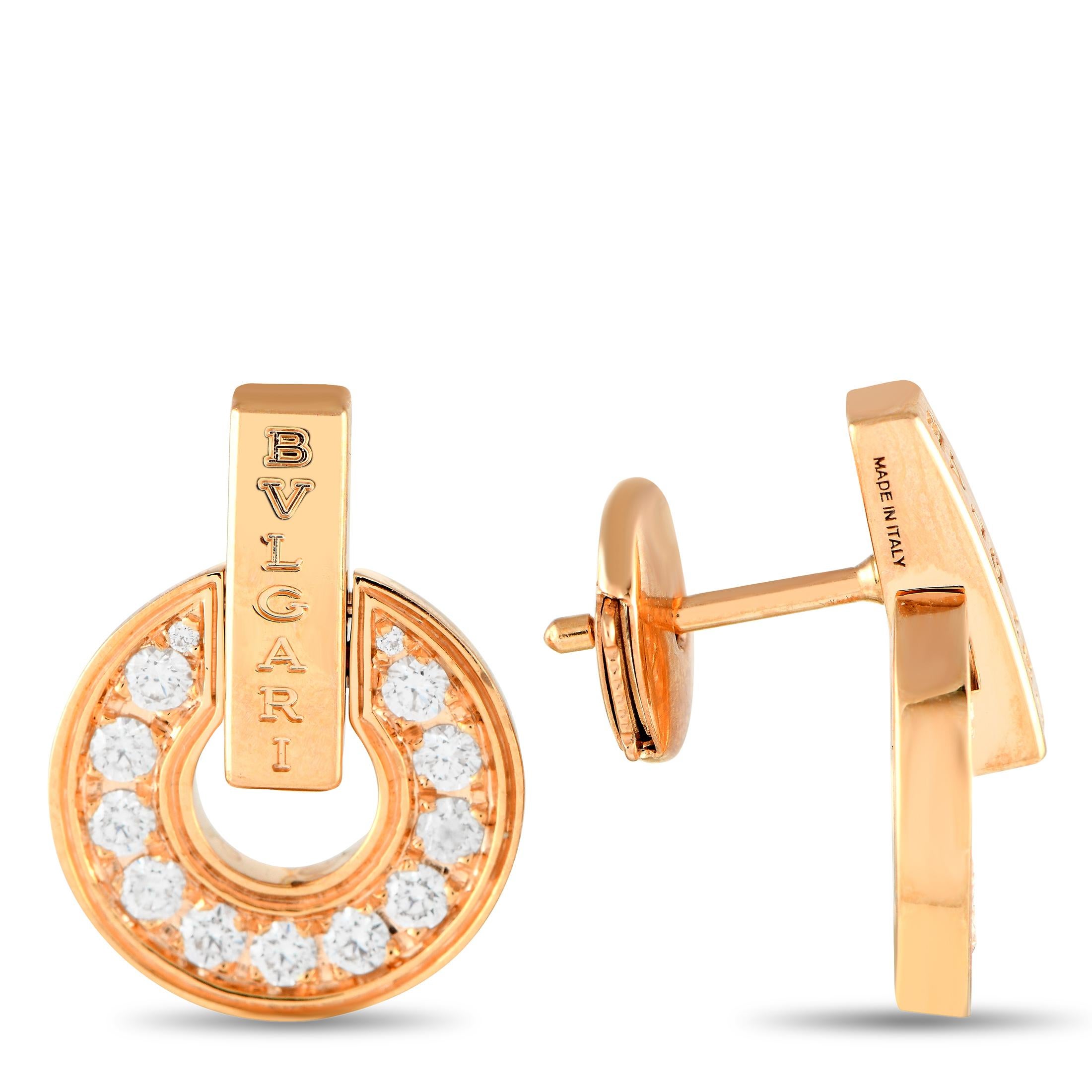 Let the restrained elegance of these Bvlgari earrings add interest to an otherwise plain outfit. The earrings feature a rose gold circlet fully set with pav diamonds and bisected by a rose gold bar post with a Bvlgari text logo.Offered in estate