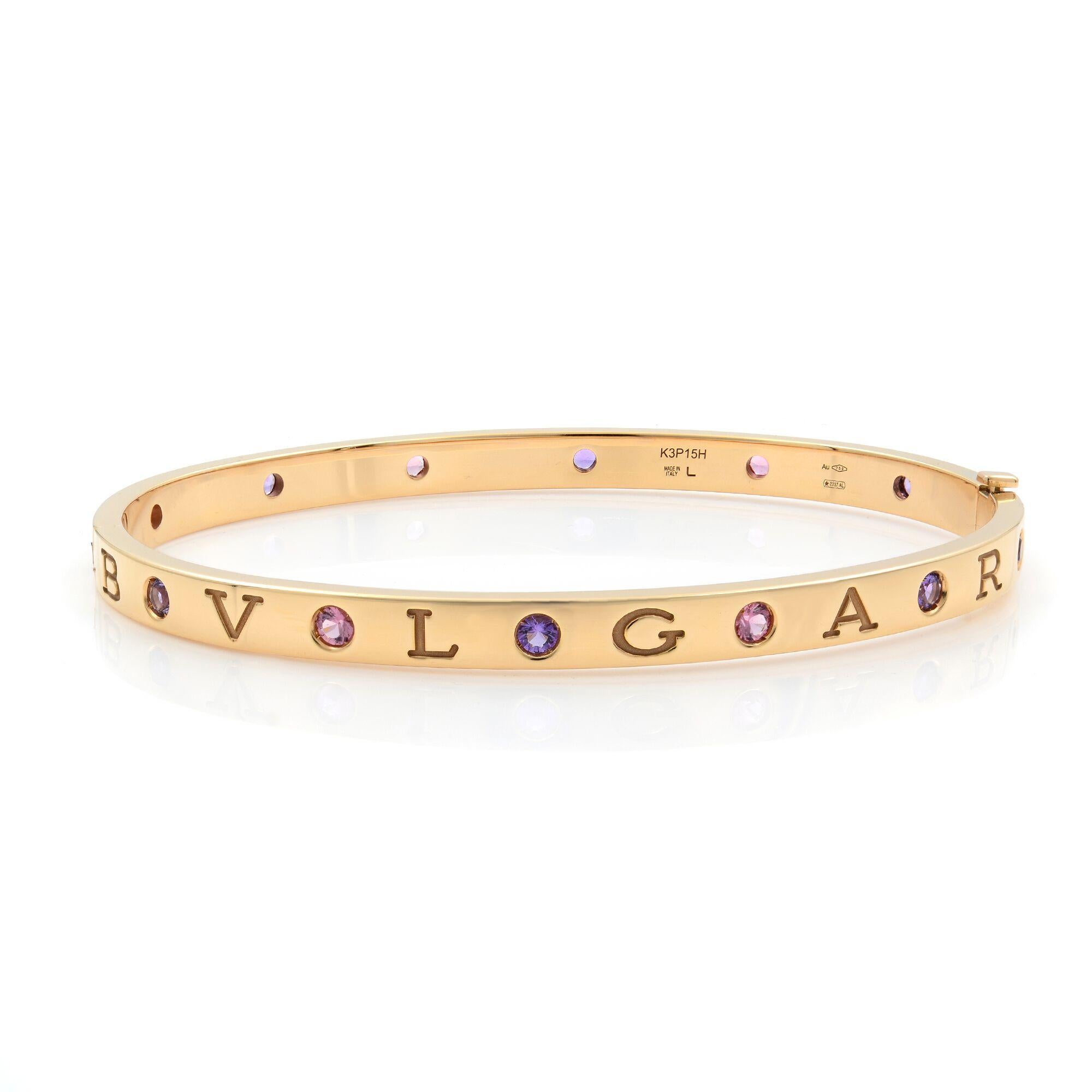 A classic Bvlgari Bvlgari18 kt rose gold bangle bracelet. This bangle is set with six amethysts and six pink tourmalines.This piece is incorporating jubilant gemstones that recall the fruitiness of fine sorbet, the BVLGARI BVLGARI ROMAN SORBETS
